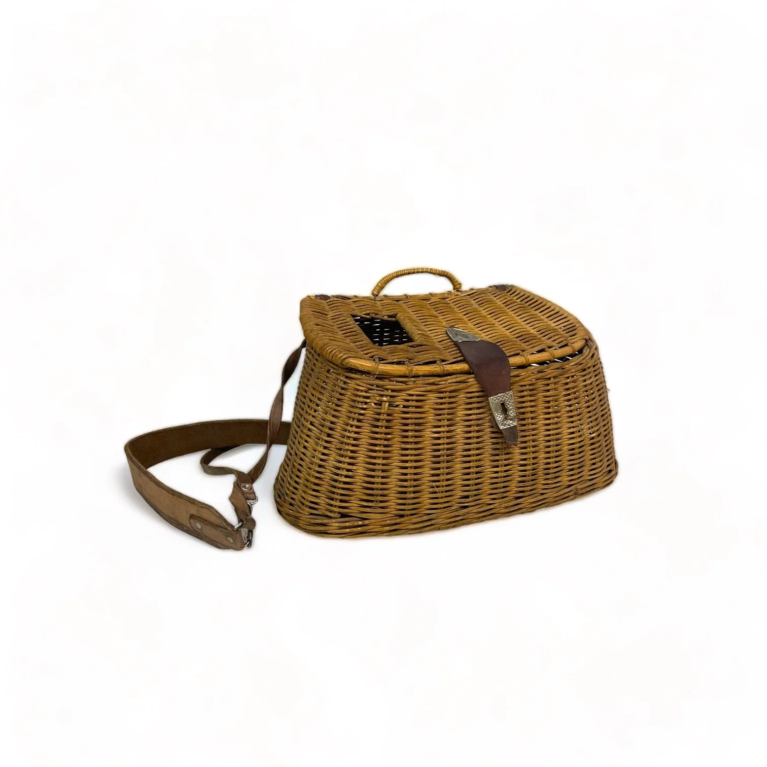 Vintage wicker fishing creel with adjustable leather shoulder strap and leather and metal lid clasp shaped as a fish. Great rustic decor for cabin or lodge.