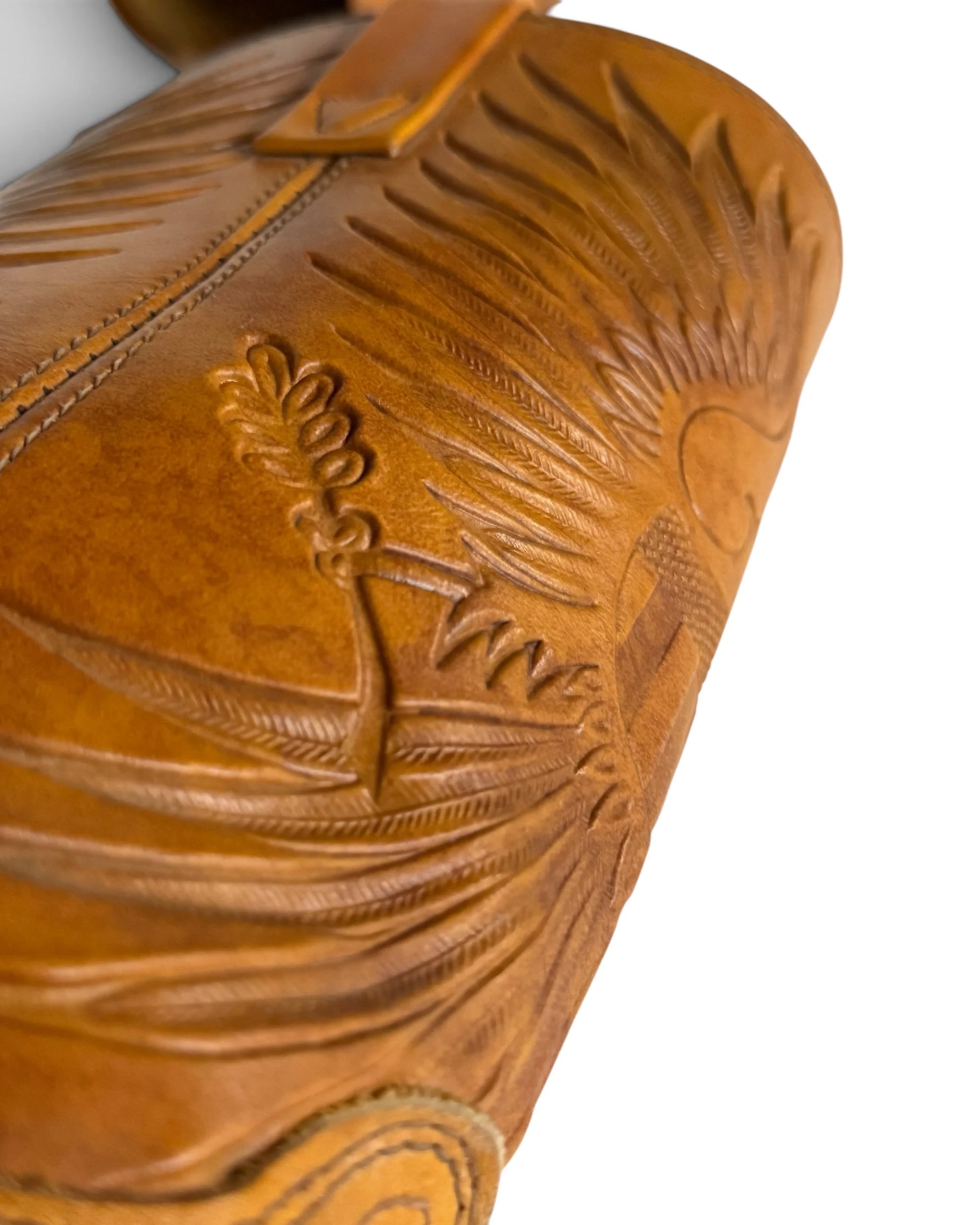 Close-up of the deeply embossed patriotic American eagle and shield motif on the camel brown leather boot shaft.