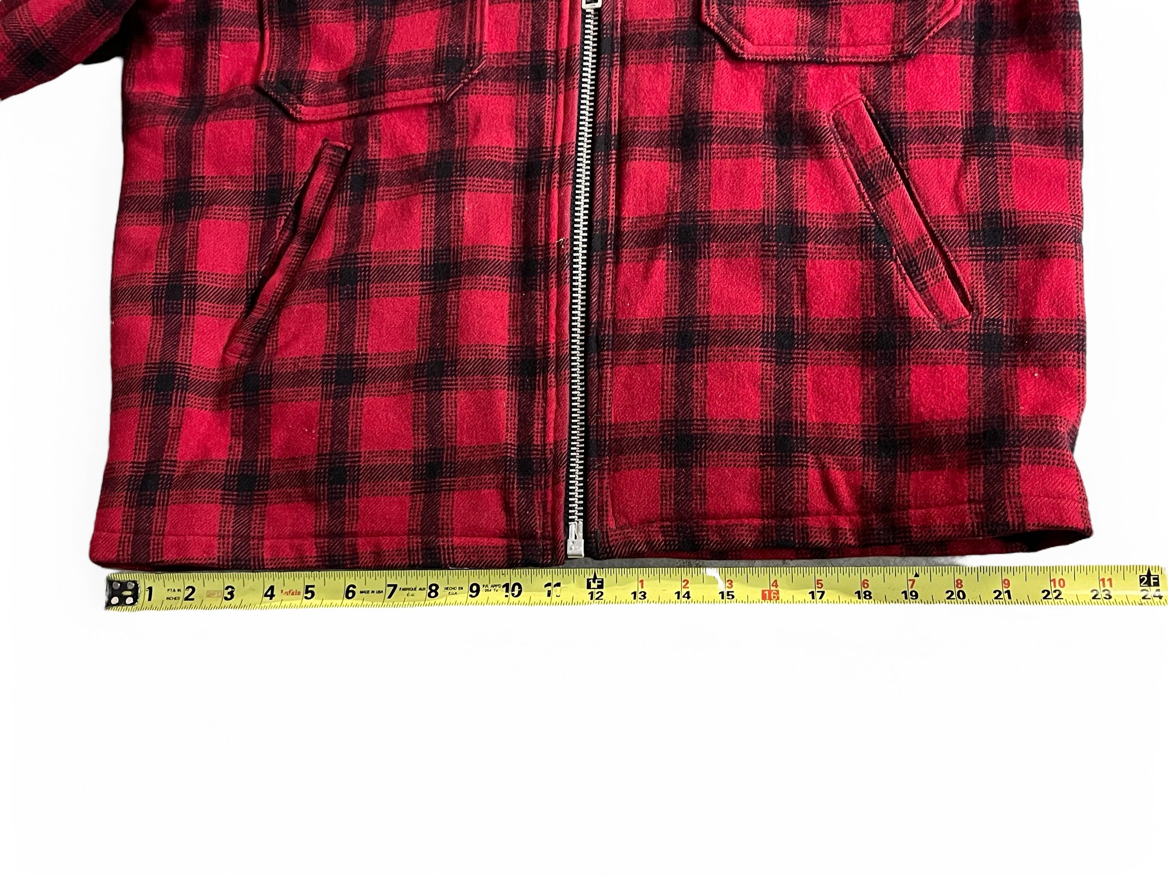 Vintage Woolrich black red plaid wool zip up jacket, fully lined, front pockets, game pocket in back, size 42. Rugged outerwear for the hunting.