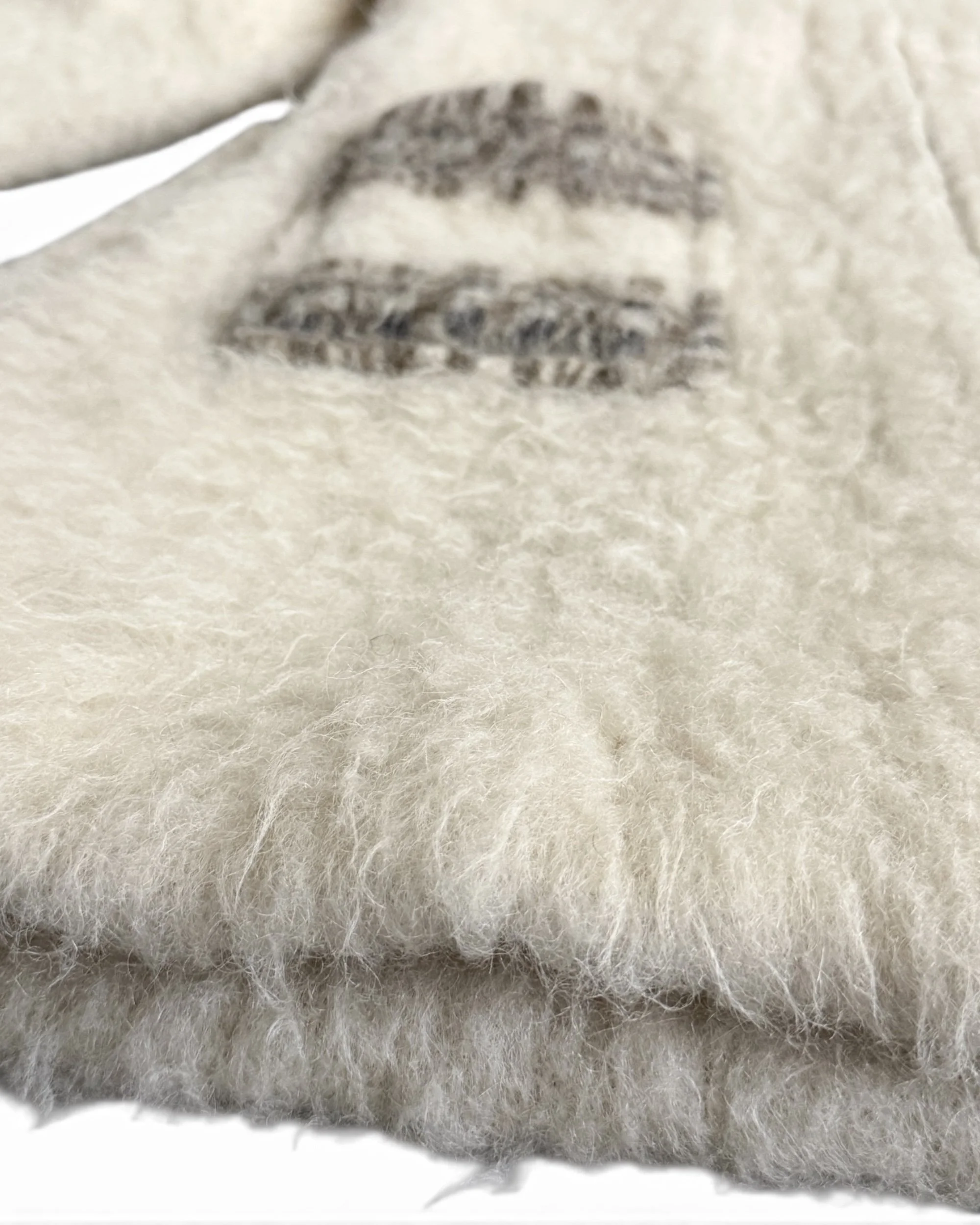 Close-up of natural curly mountain sheep wool texture on 1970s Curly Products vintage coat