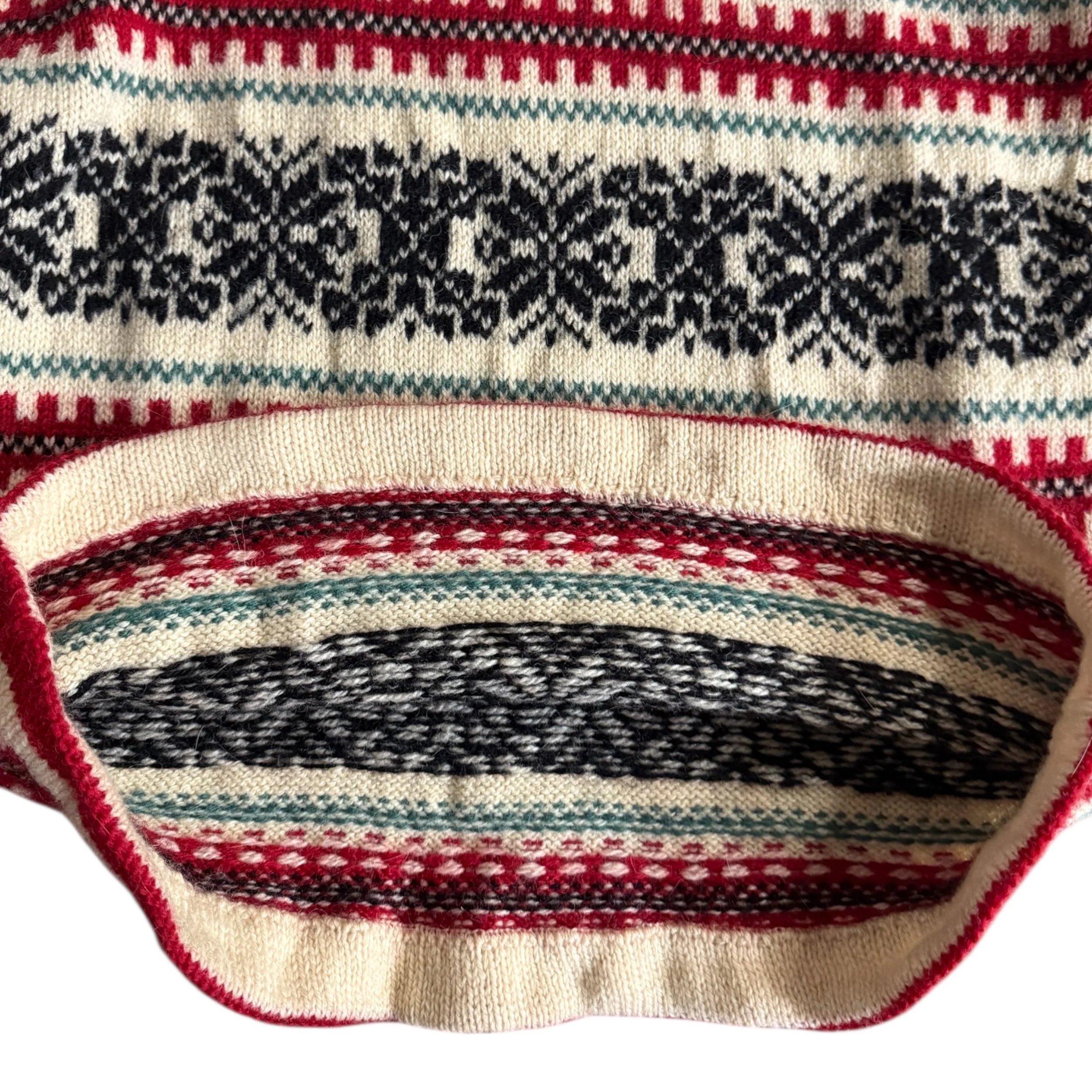 Close up of snowflake pattern and inside hemline on Norwegian 100% virgin wool sweater