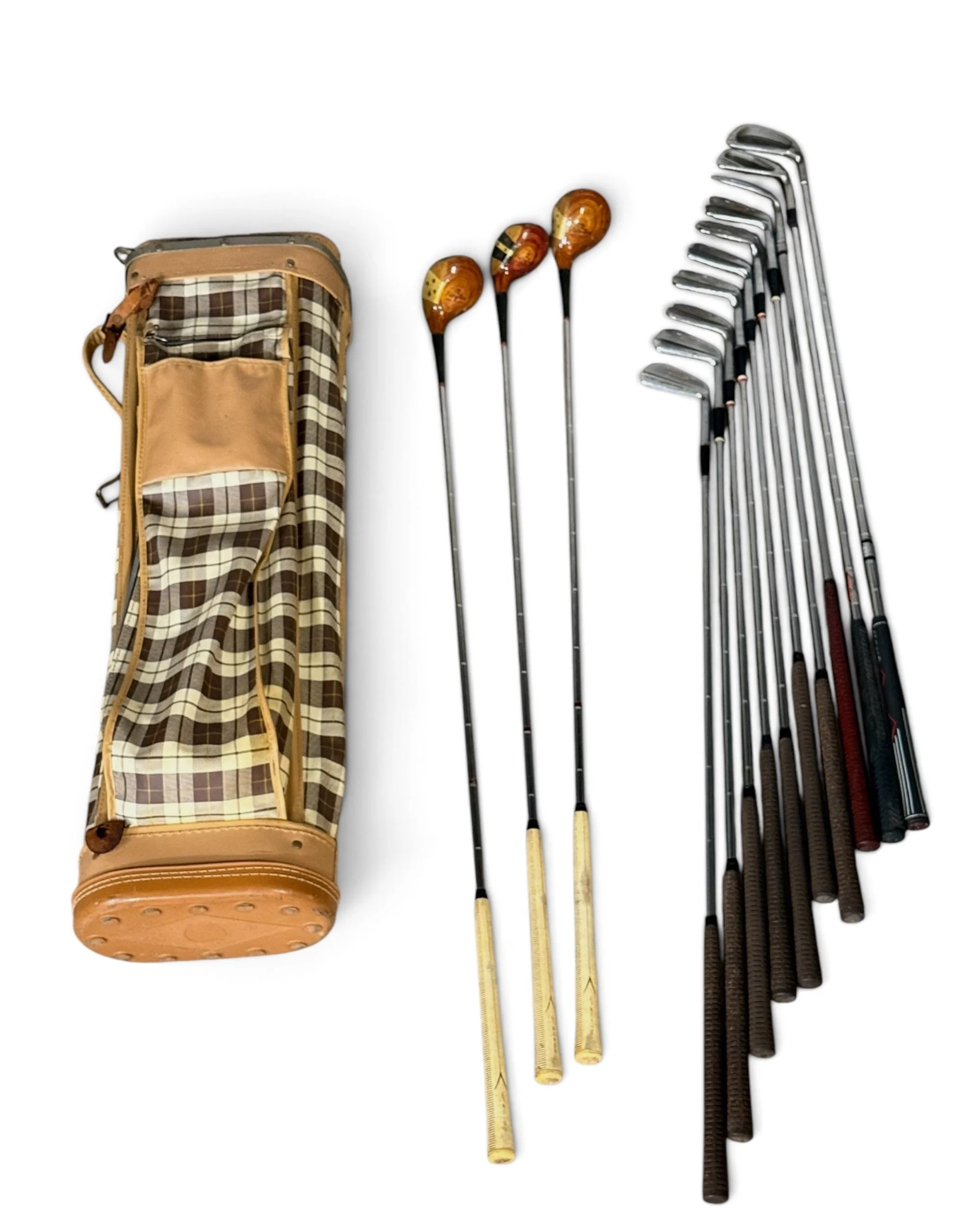Vintage plaid golf bag with a top view of assortment of woods and irons