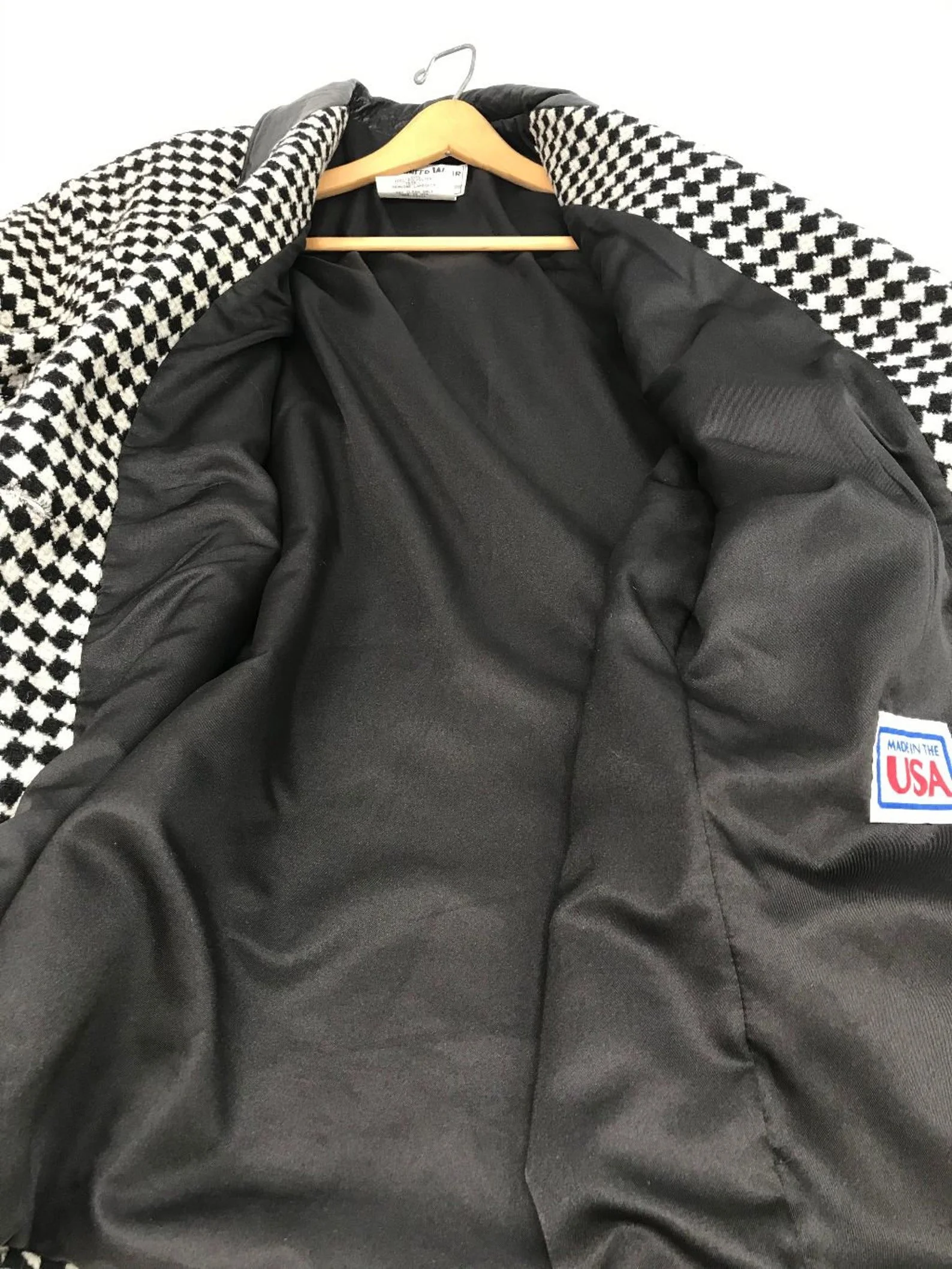 Vintage Pioneer Wear womens size medium black and white houndstooth coat, fully lined, trimmed in black leather, button front closure, two side pockets.