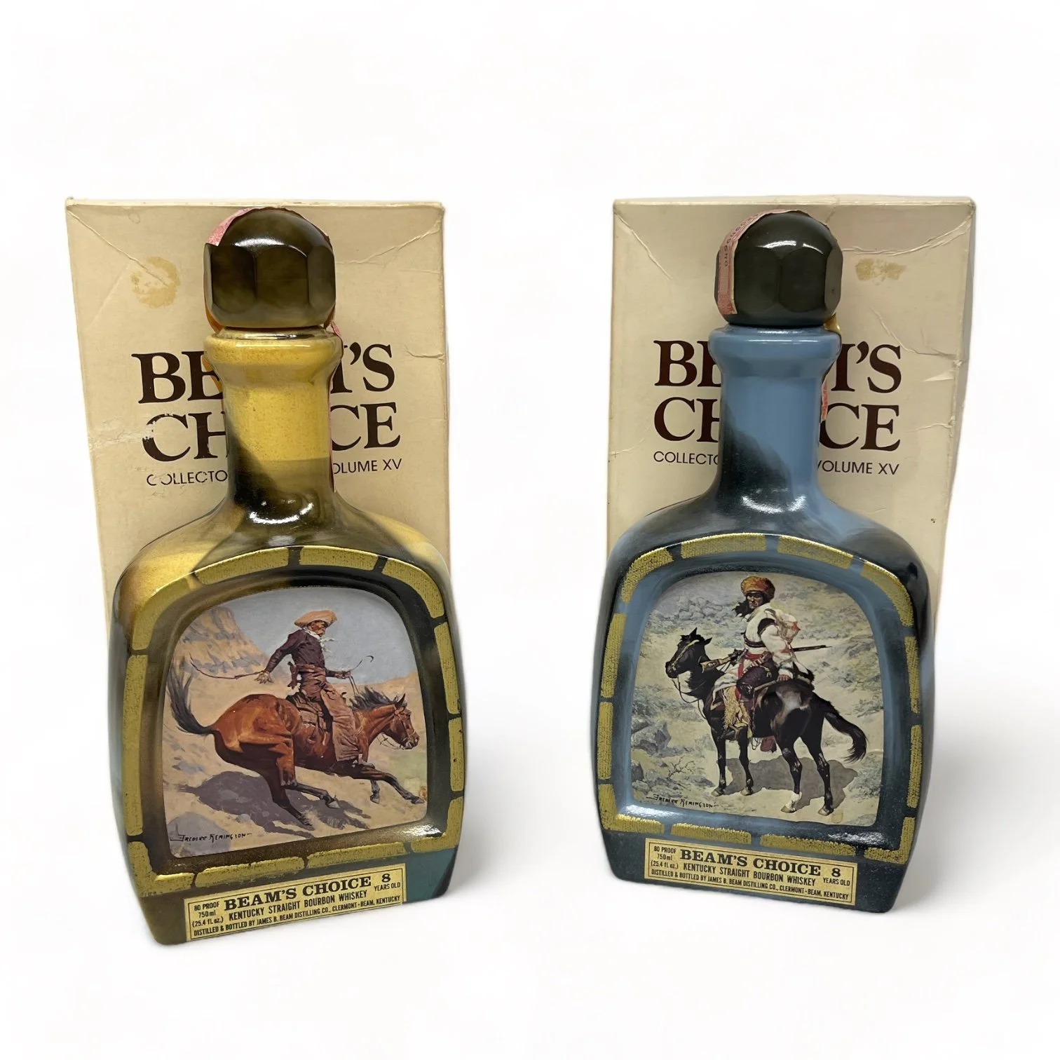 Vintage pair of glass 1970s Jim Beam Choice liquor bottles, featuring the cowboy and the Indian trapper. Perfect home bar decor.