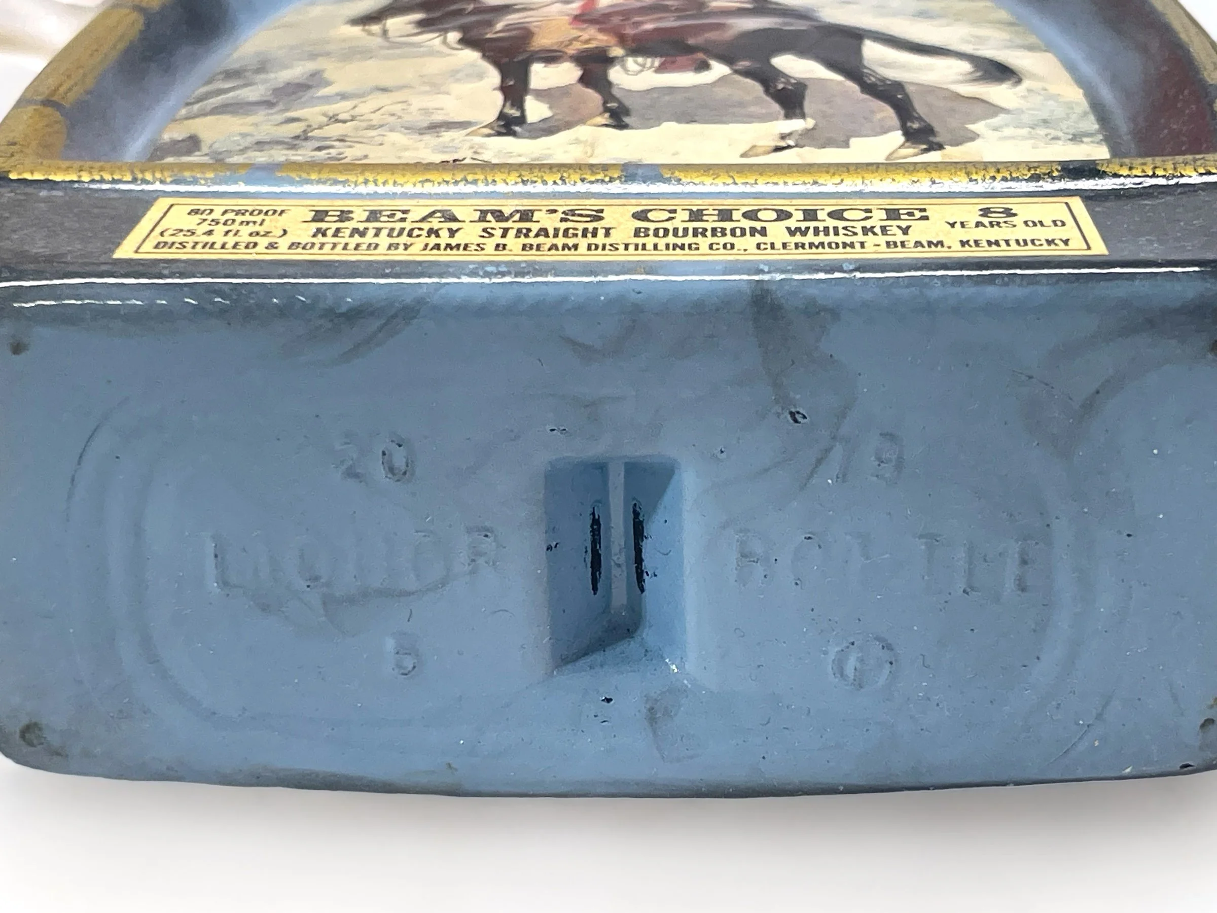 Vintage pair of glass 1970s Jim Beam Choice liquor bottles, featuring the cowboy and the Indian trapper. Perfect home bar decor.