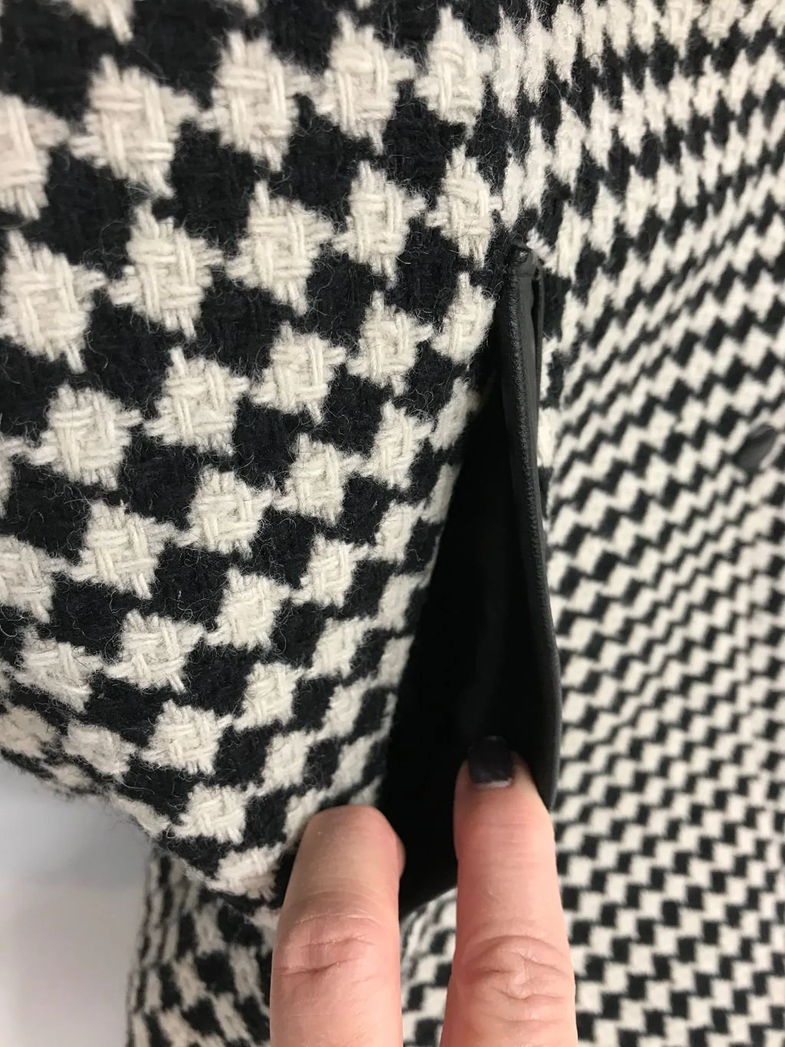 Vintage Pioneer Wear womens size medium black and white houndstooth coat, fully lined, trimmed in black leather, button front closure, two side pockets.