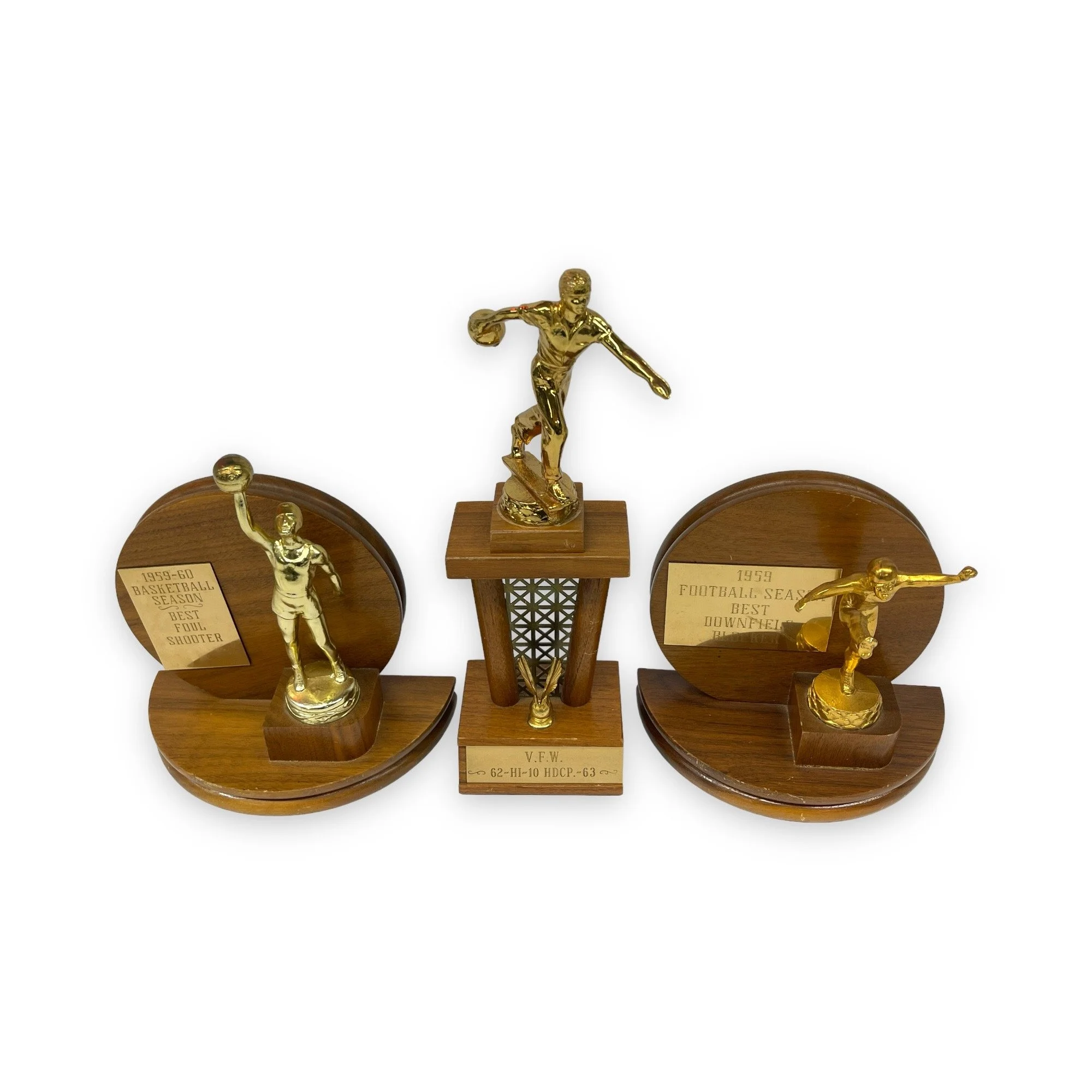 Vintage set of 3 trophies in mid century modern designs. Trophies are from the 50s and 60s and are made of wood with gold metal engraved plates.