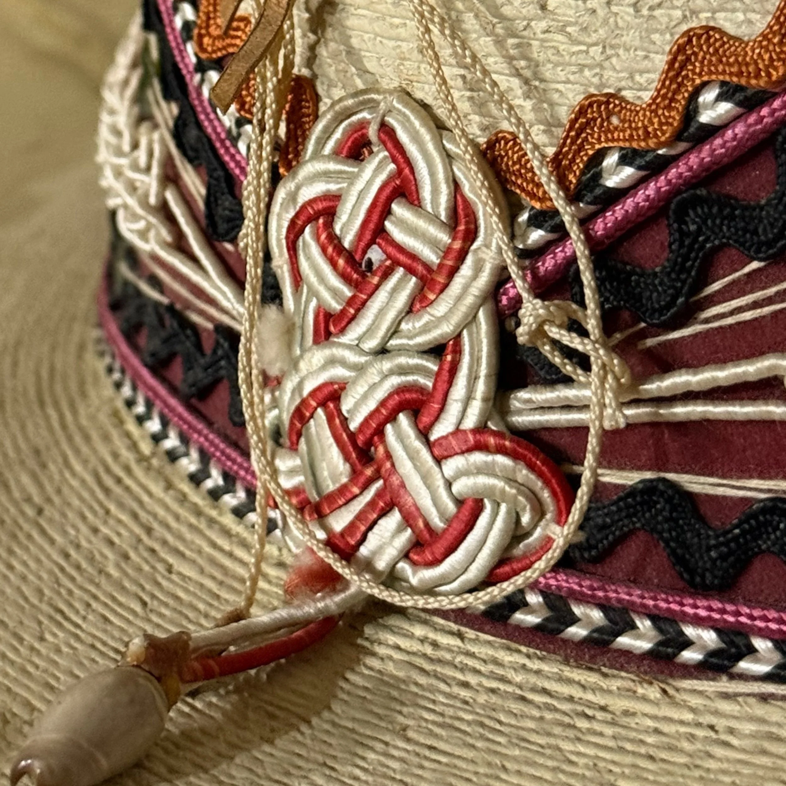 Close-up of embroidery and textured straw weave on a vintage Alberto Chavez sombrero