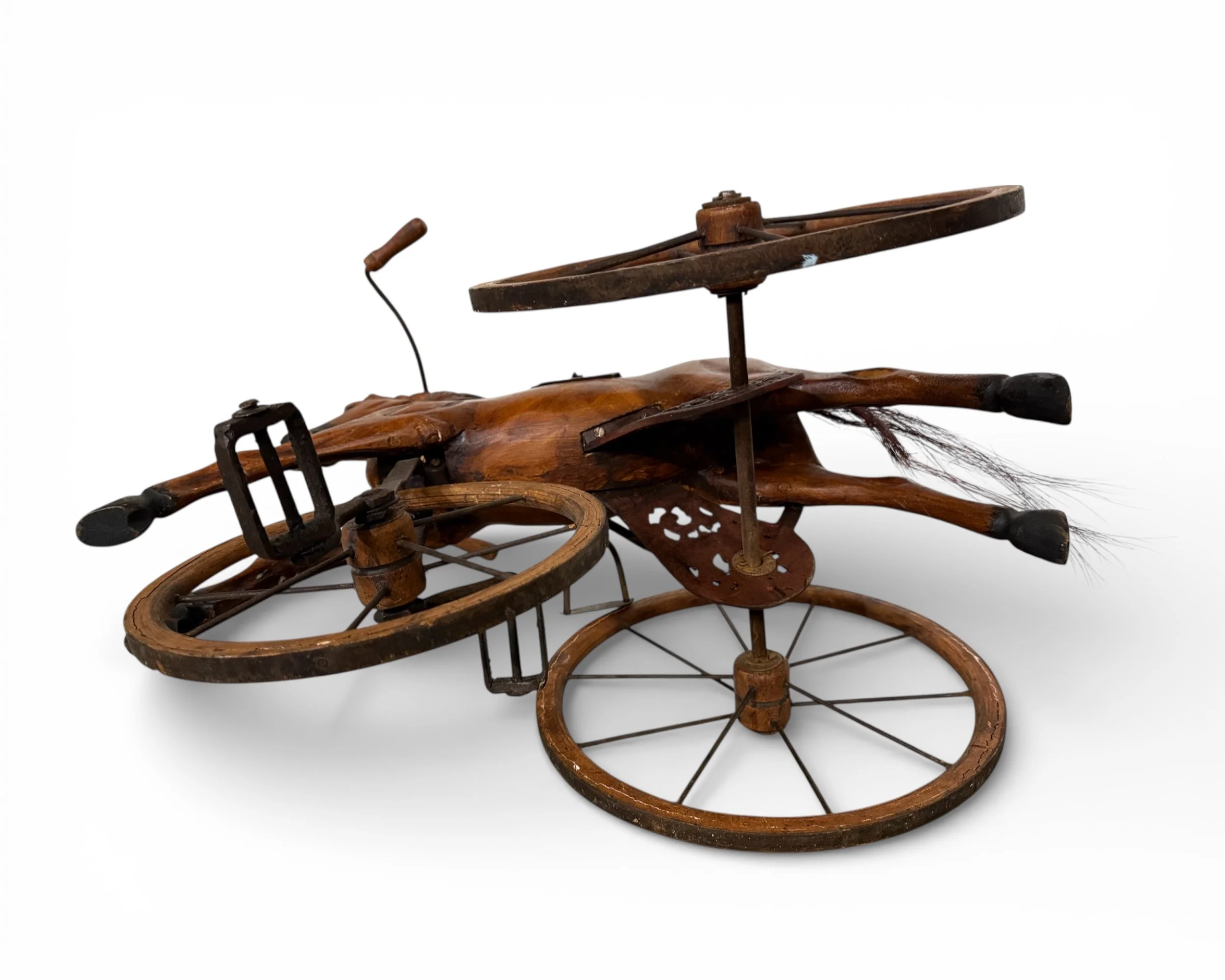 bottom view of wooden vintage horse peddle trike