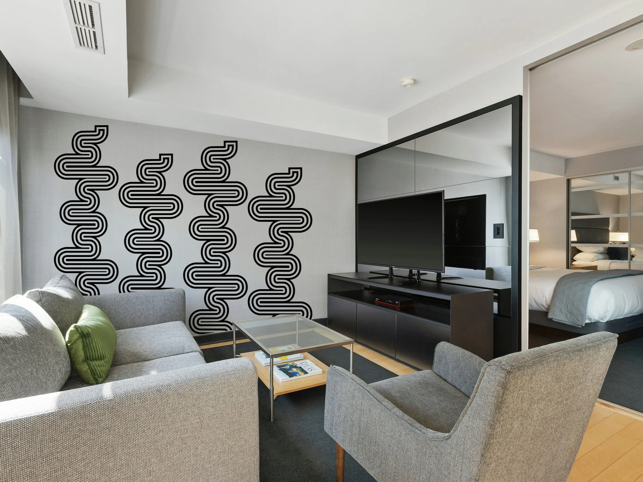Removable retro geometric vinyl wall decal in hotel living room decor.