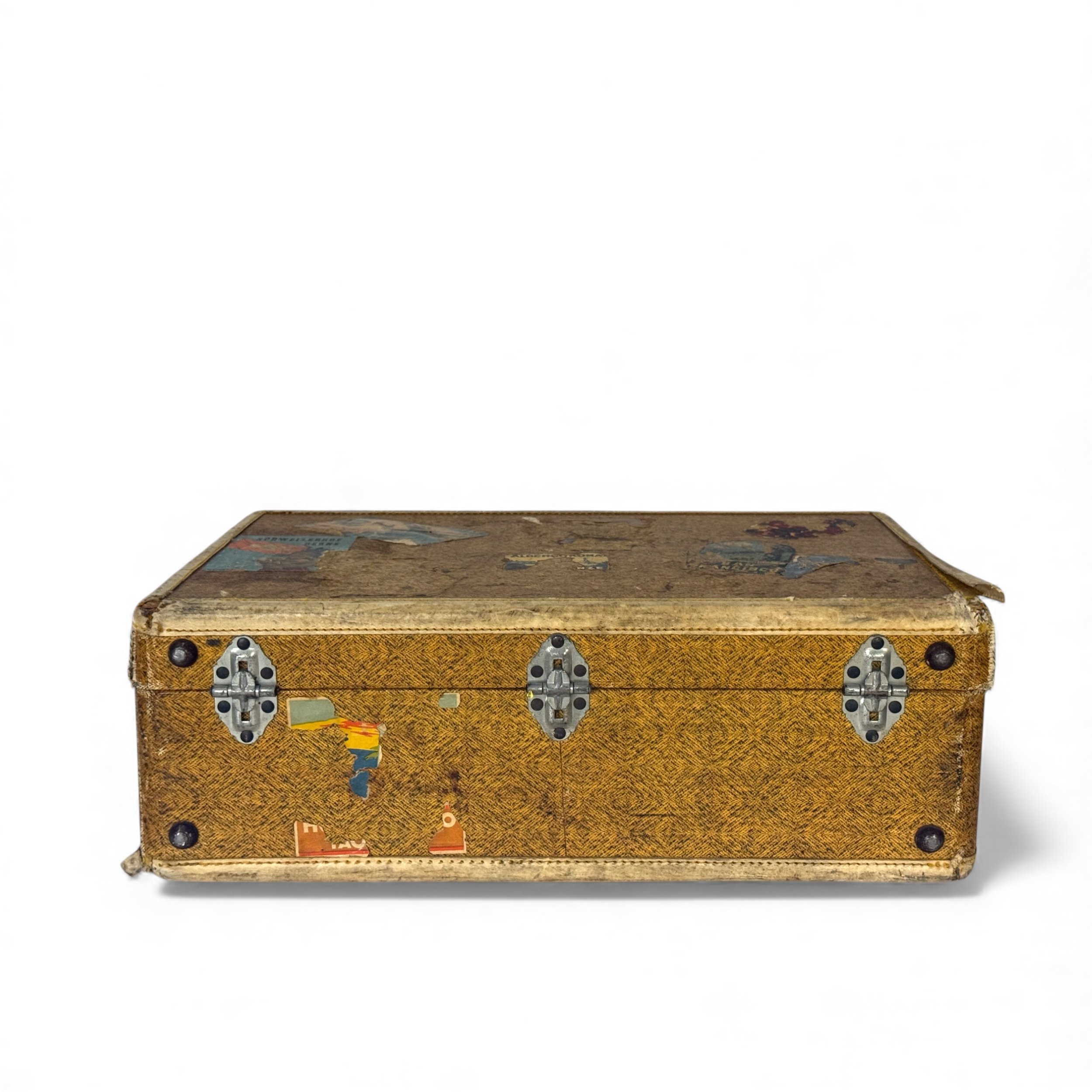 Flat view with focus on bottom of antique travel suitcase with silver metal hinges