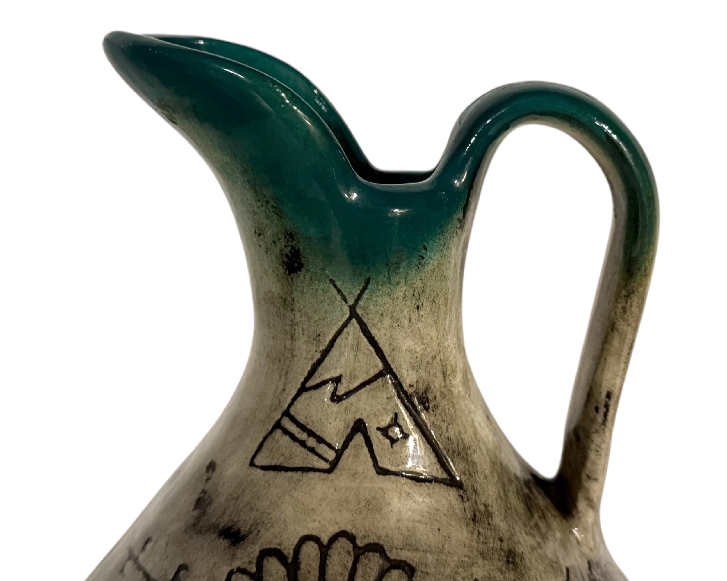 Close up turquoise green glaze rim vintage ceramic pitcher