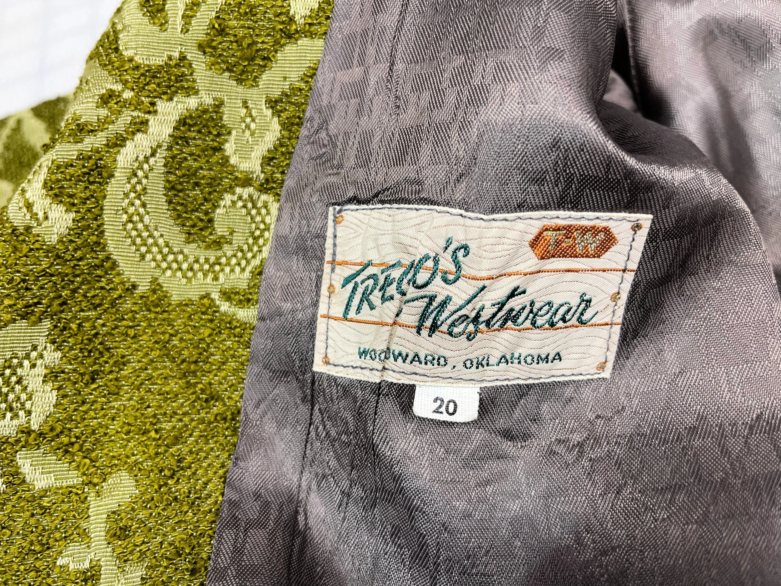 Vintage 1960s women's Westwear jacket in green floral tapestry, classic ranch style with button front closure, fully lined, front pockets, and western yoke detailing.