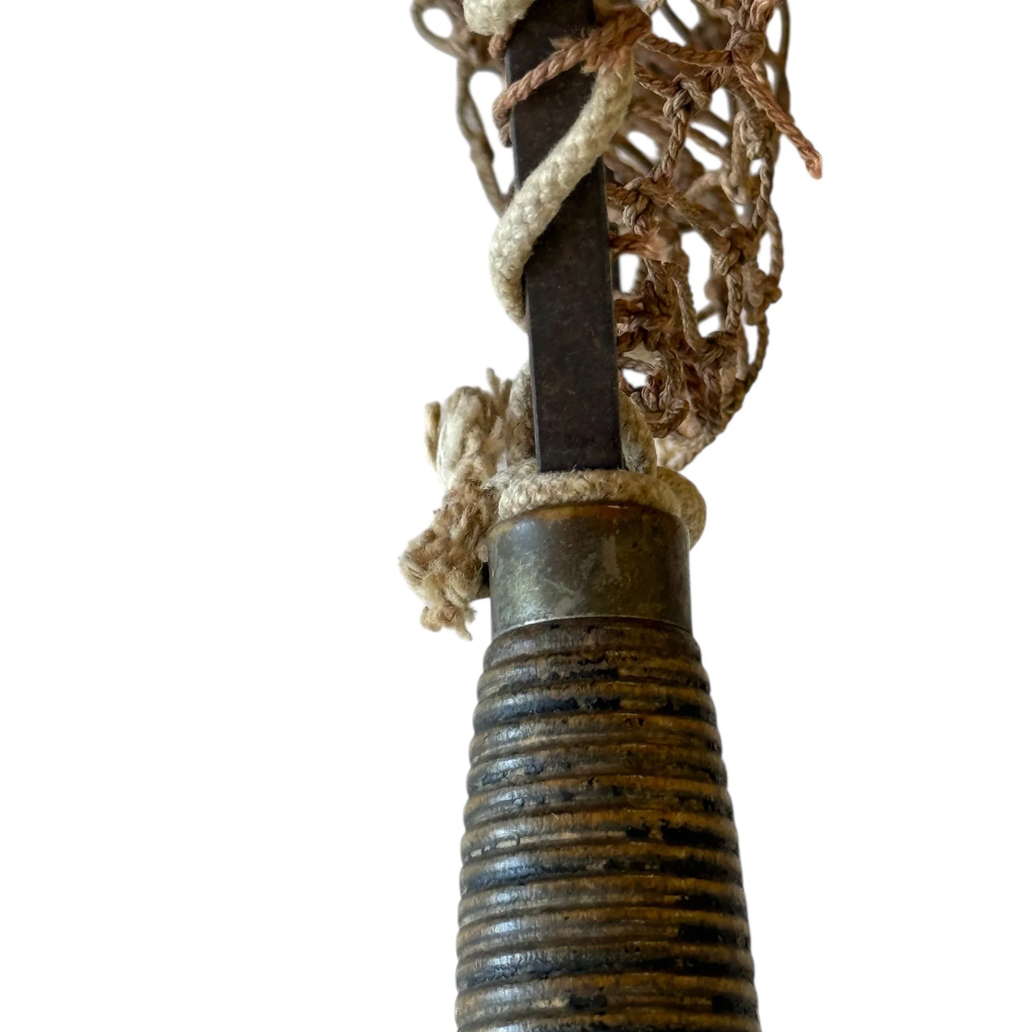 Handle detail of antique fishing net, handle is made of wood in a spool-like design