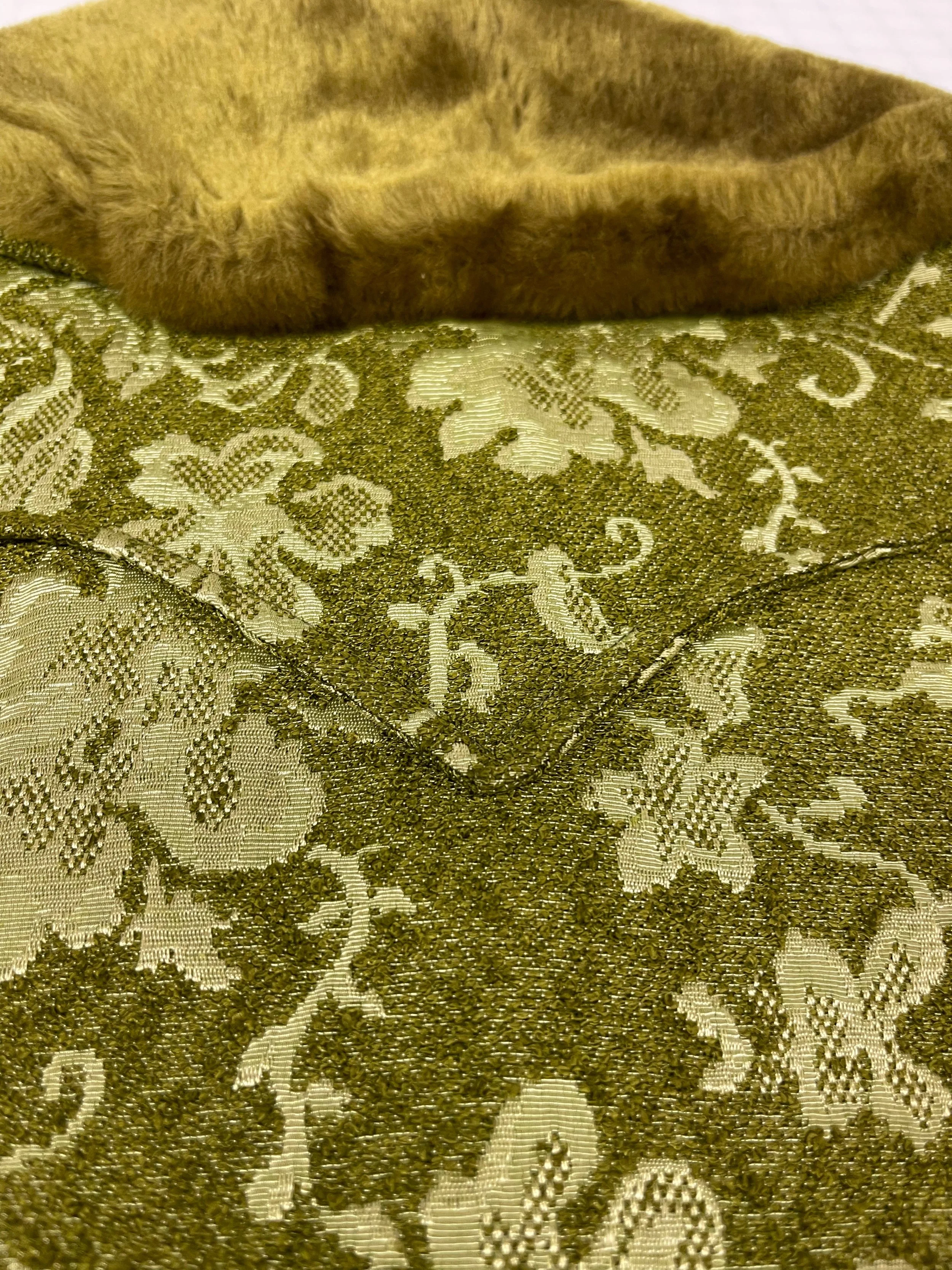 Vintage 1960s women's Westwear jacket in green floral tapestry, classic ranch style with button front closure, fully lined, front pockets, and western yoke detailing.