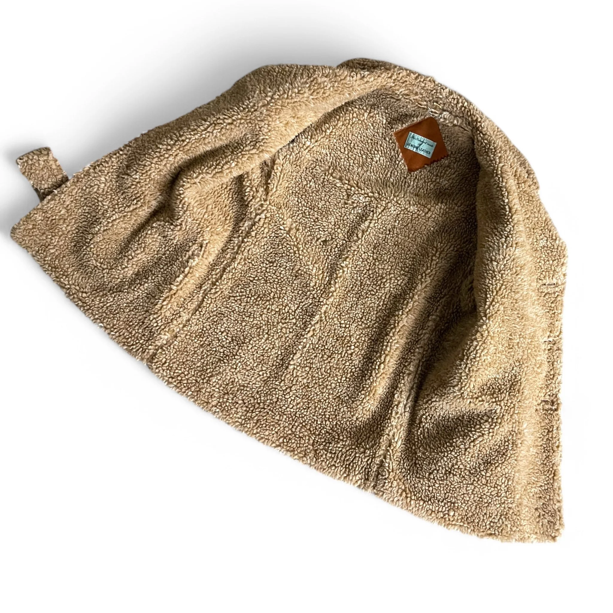 Vintage mens rancher style leather suede coat, size 38, fully lined with Sherpa. Features a button front closure and two front hand pockets for a classic Western look.