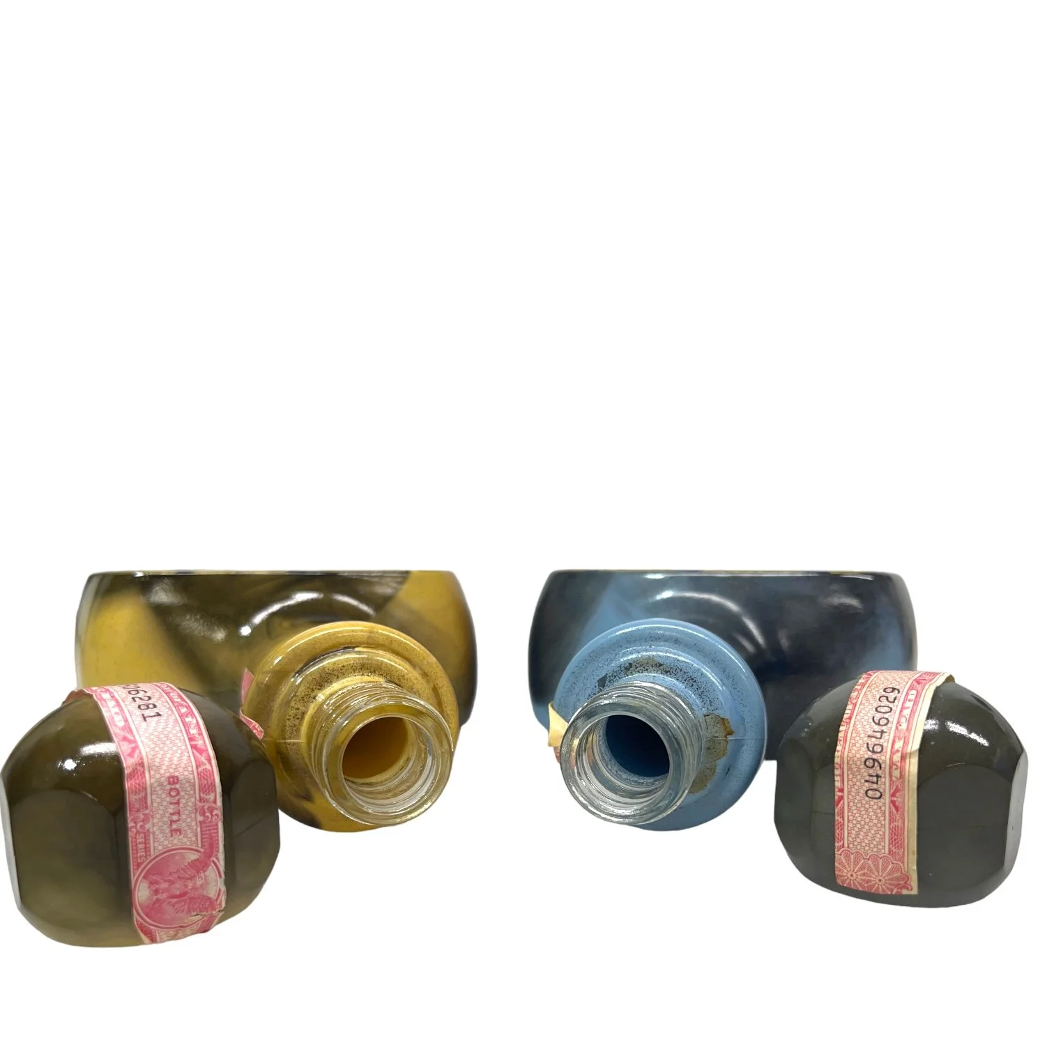 Vintage pair of glass 1970s Jim Beam Choice liquor bottles, featuring the cowboy and the Indian trapper. Perfect home bar decor.