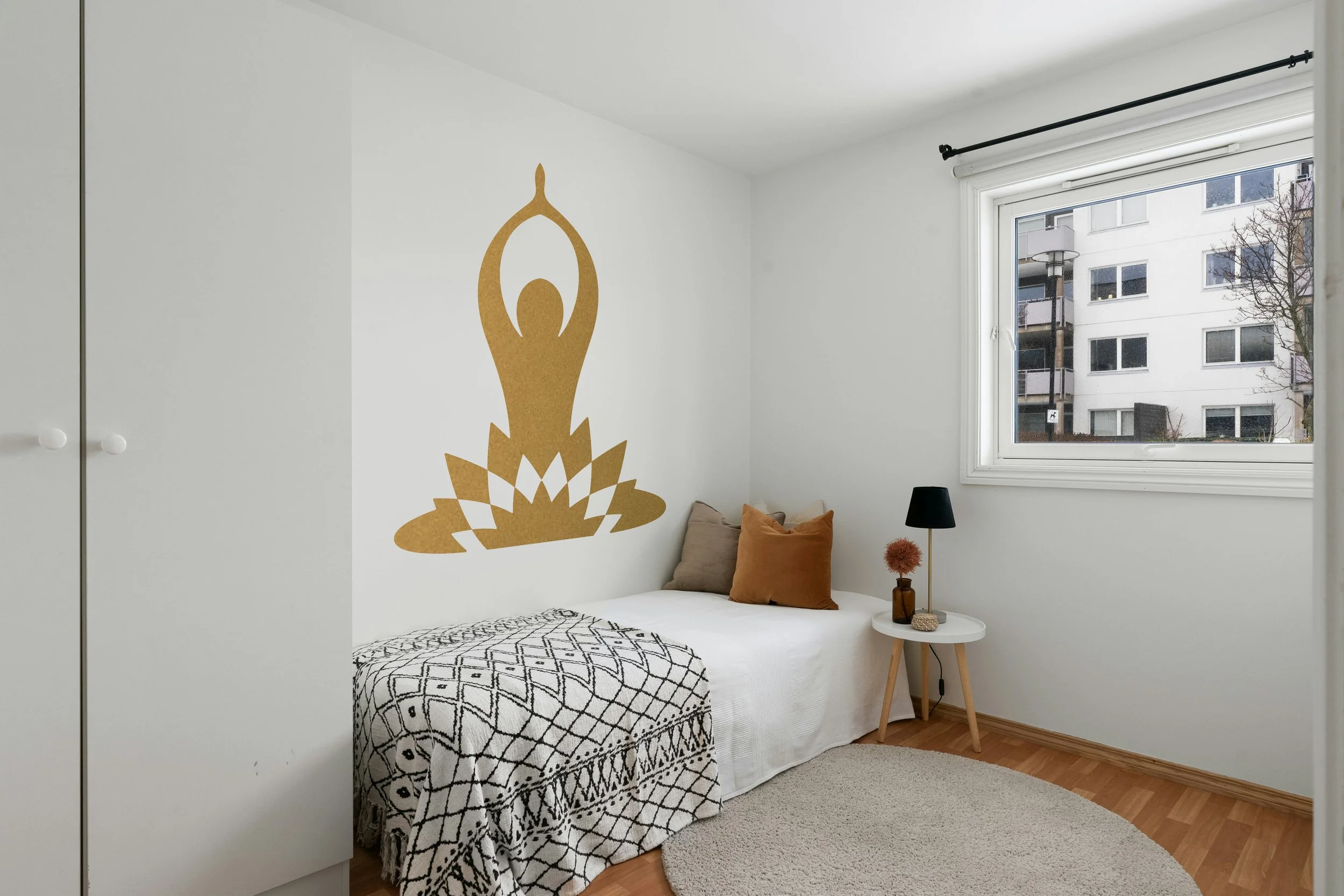 Yoga pose with lotus flower removable vinyl wall decal in metallic gold.