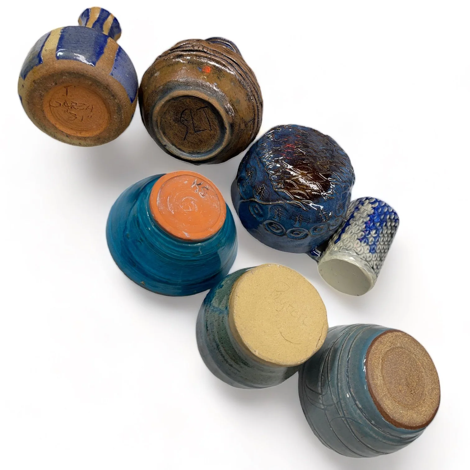 Vintage 7 piece handmade studio pottery collection of vases, bowls, mug in blue, turquoise and brown.