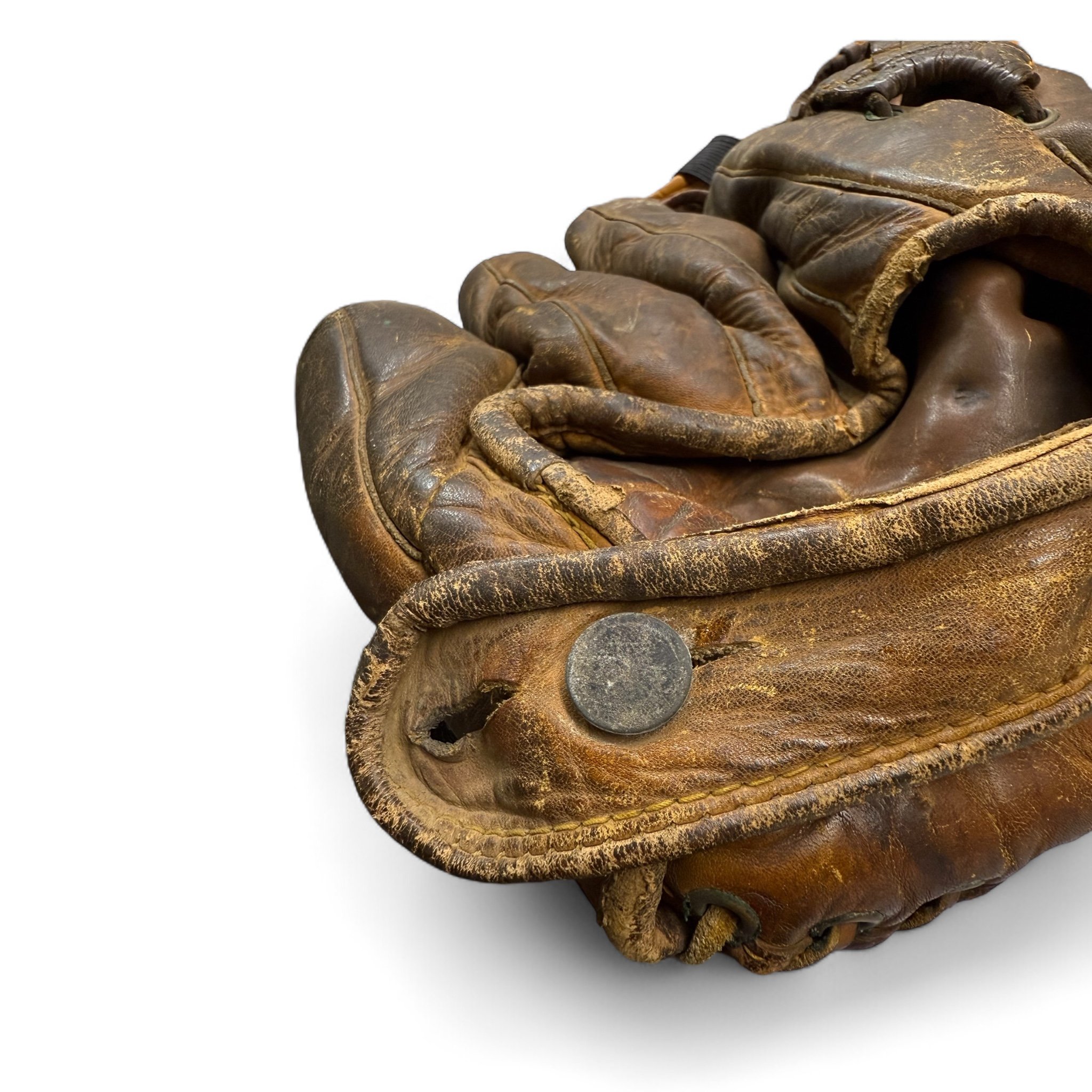 Vintage 1930s Rawlings leather baseball glove with rich patina, ideal for sports collectors and rustic game room decor.