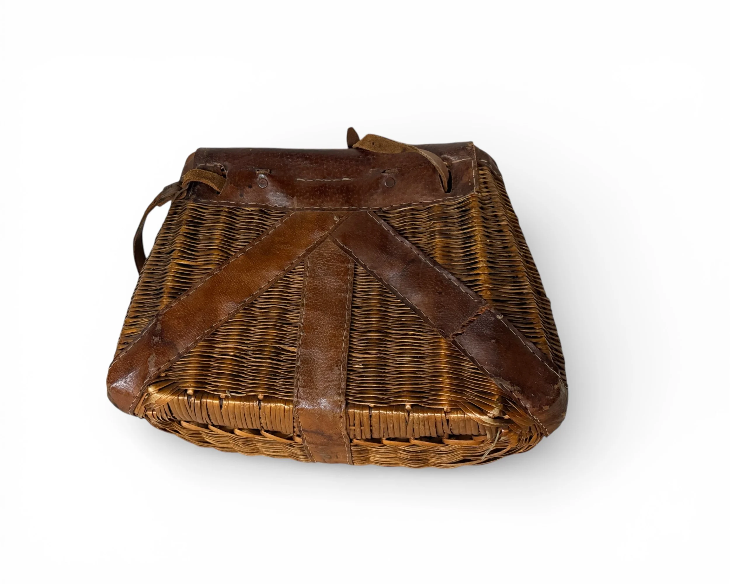 back view of wicker woven 1950s fishing creel for rustic cabin lodge decor