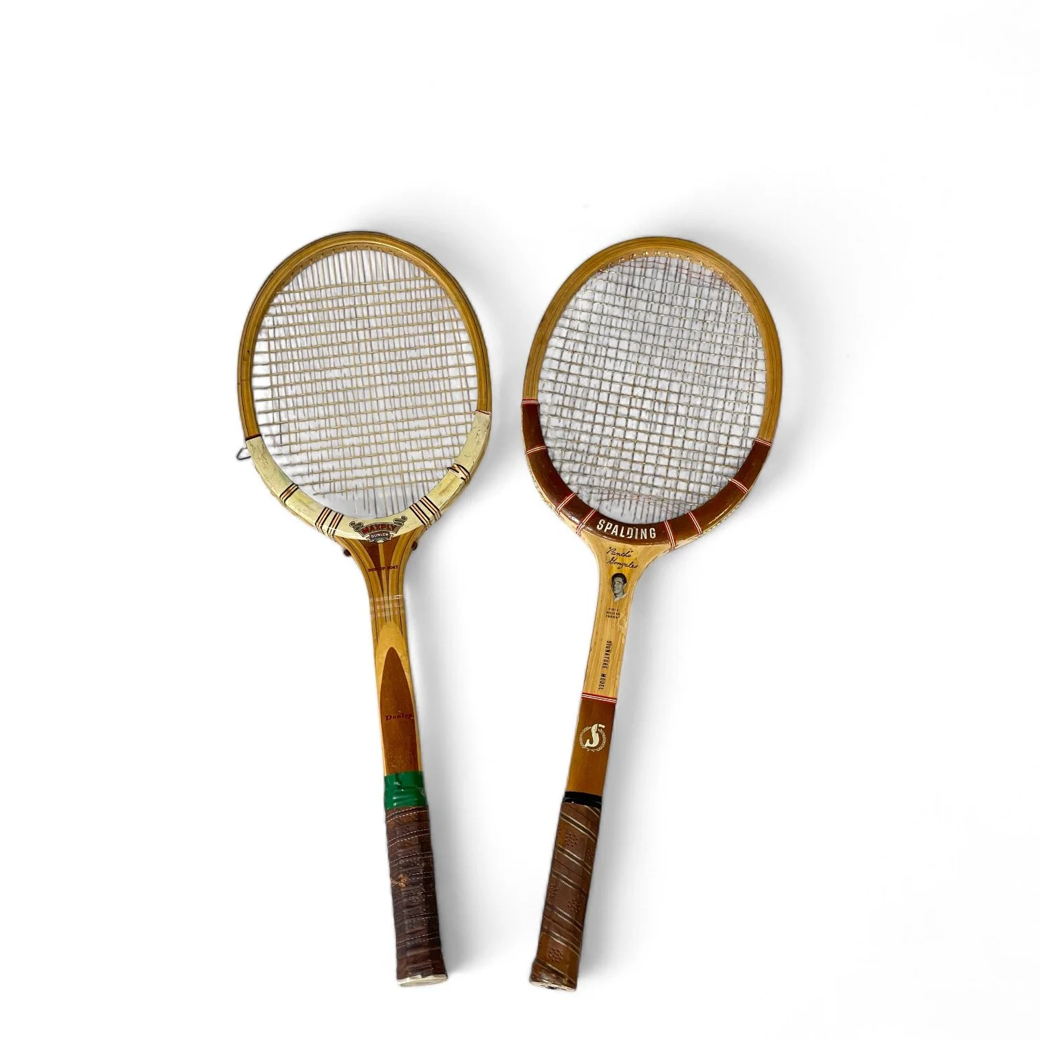 Vintage pair of wooden tennis rackets, Dunlop Maxply, Spalding Gonzales signature model.