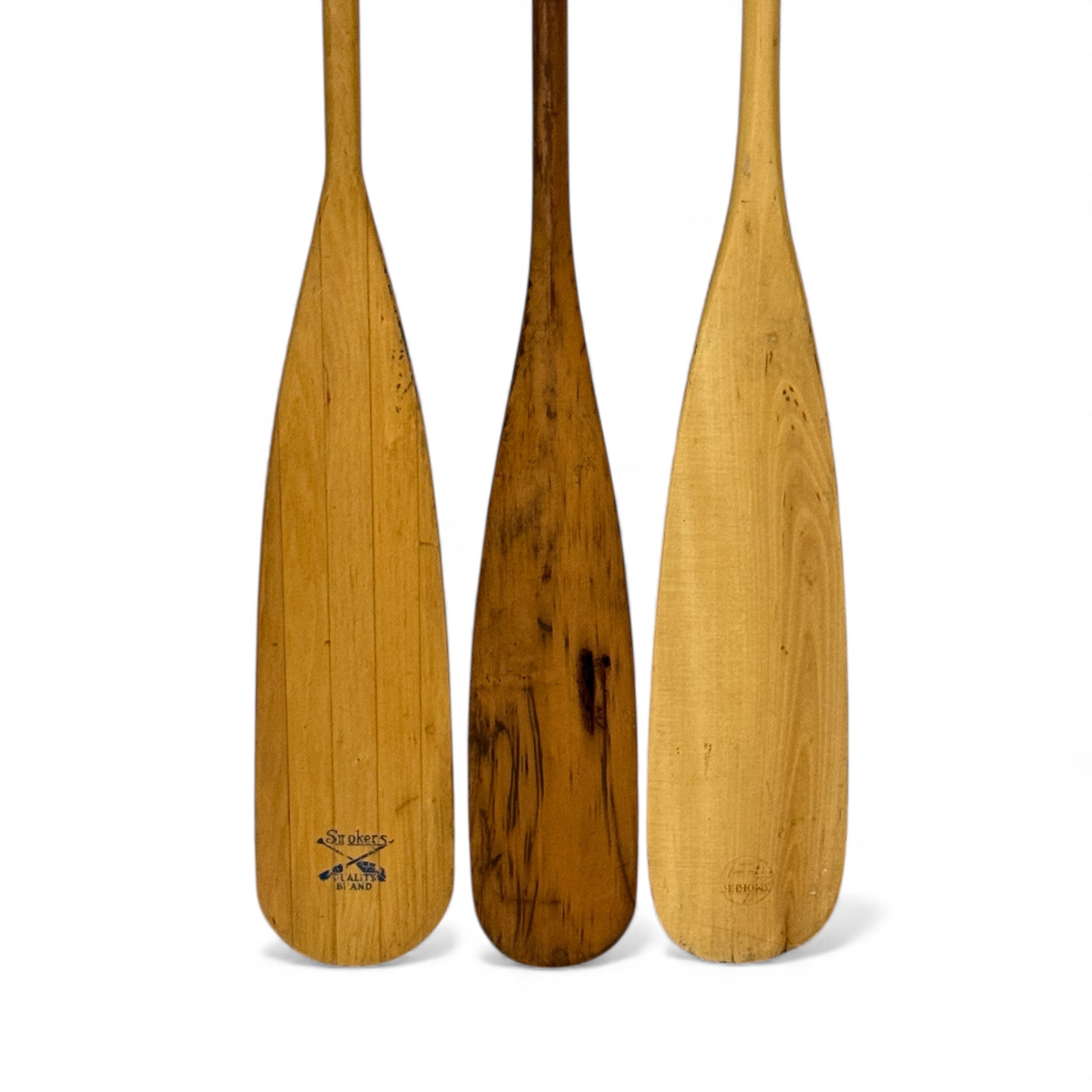 close up view of 3 vintage wooden boat oar paddles with stamped Smoker logo