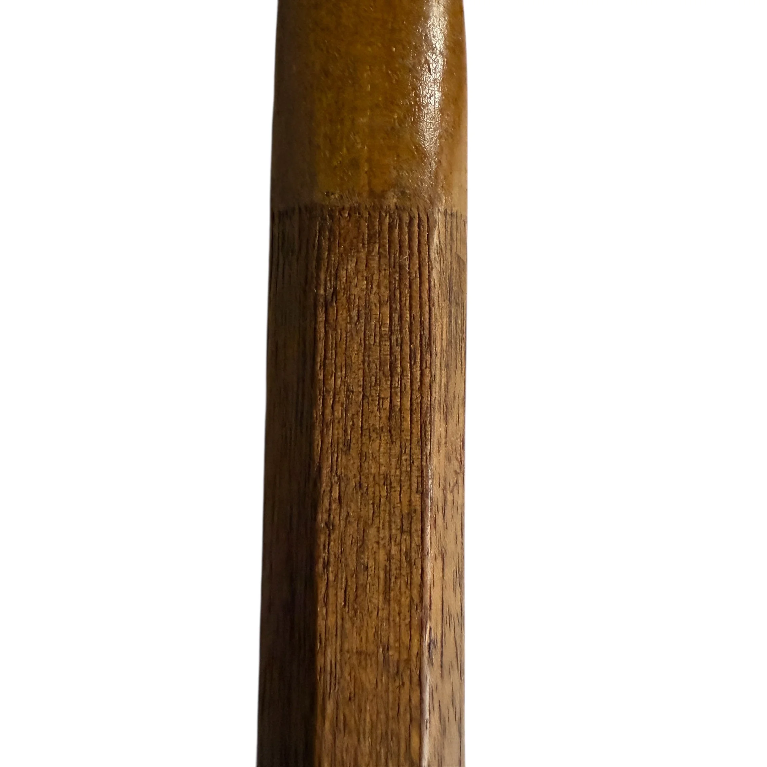 close up view of wooden handle on antique tennis racket showing wood grain details