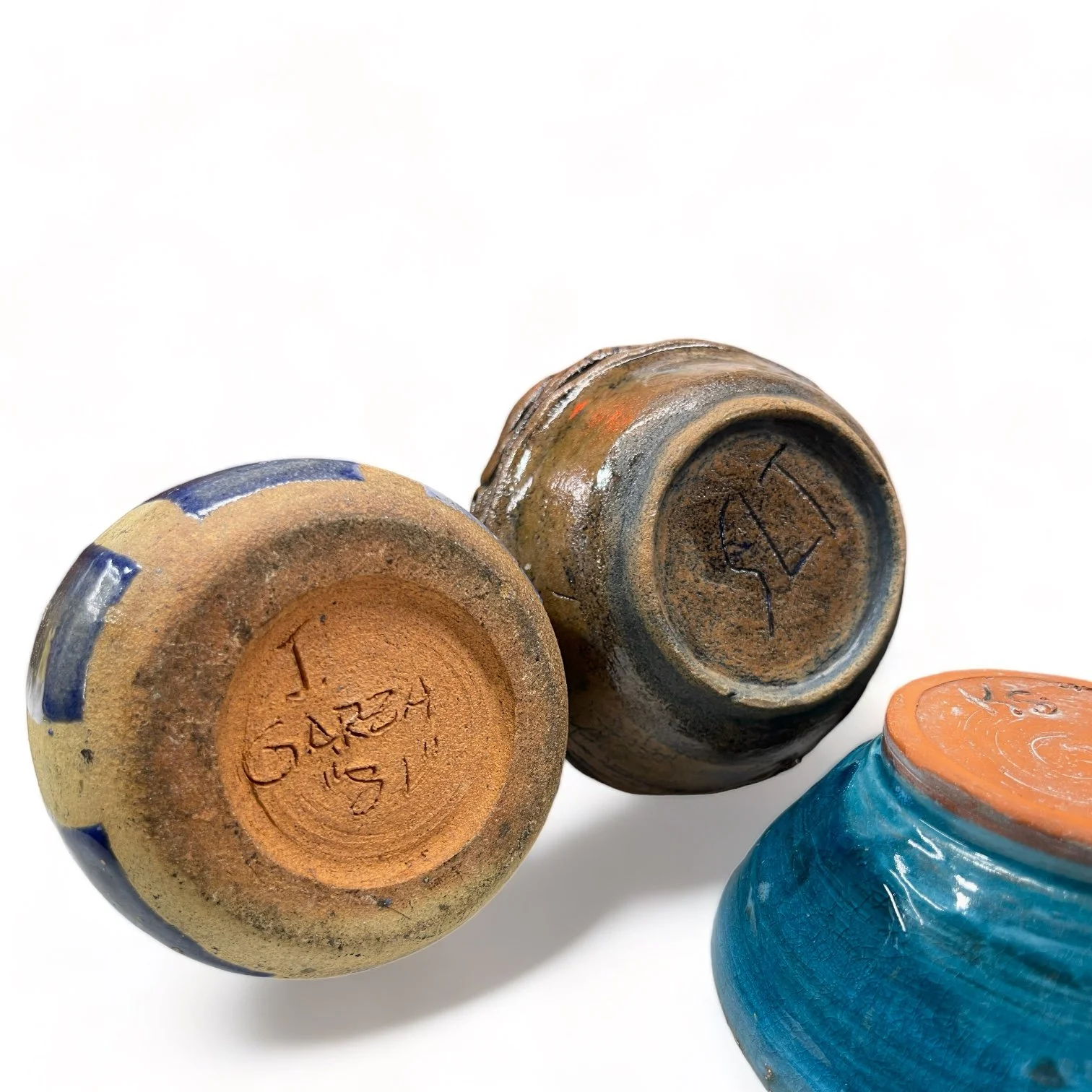 Vintage 7 piece handmade studio pottery collection of vases, bowls, mug in blue, turquoise and brown.