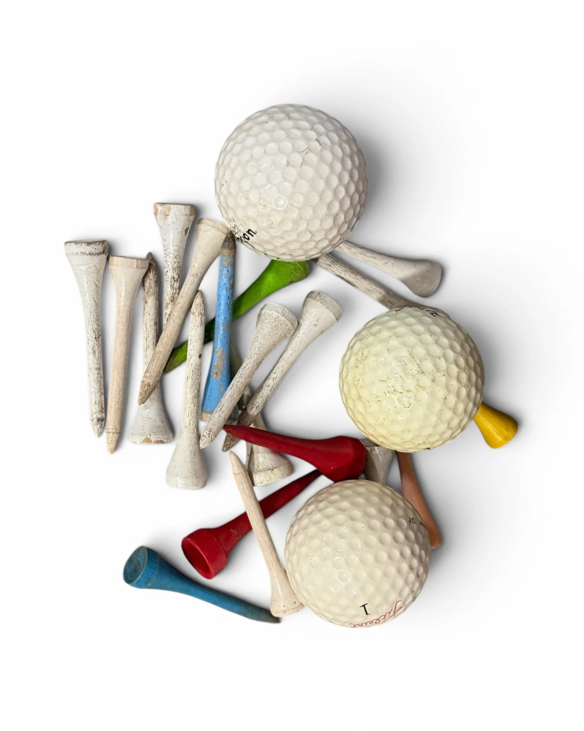 vintage set of golf balls and wooden tees