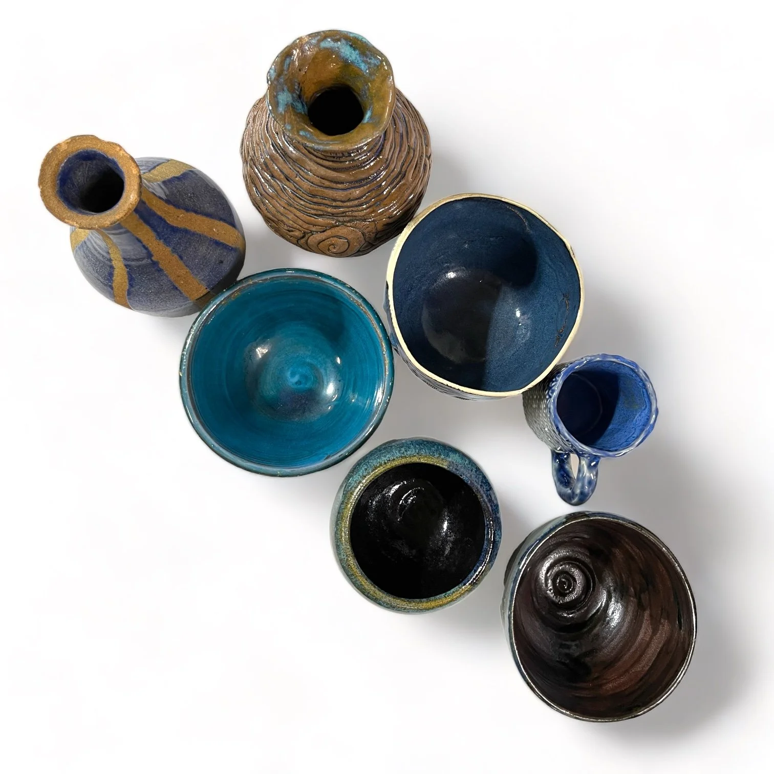 Vintage 7 piece handmade studio pottery collection of vases, bowls, mug in blue, turquoise and brown.