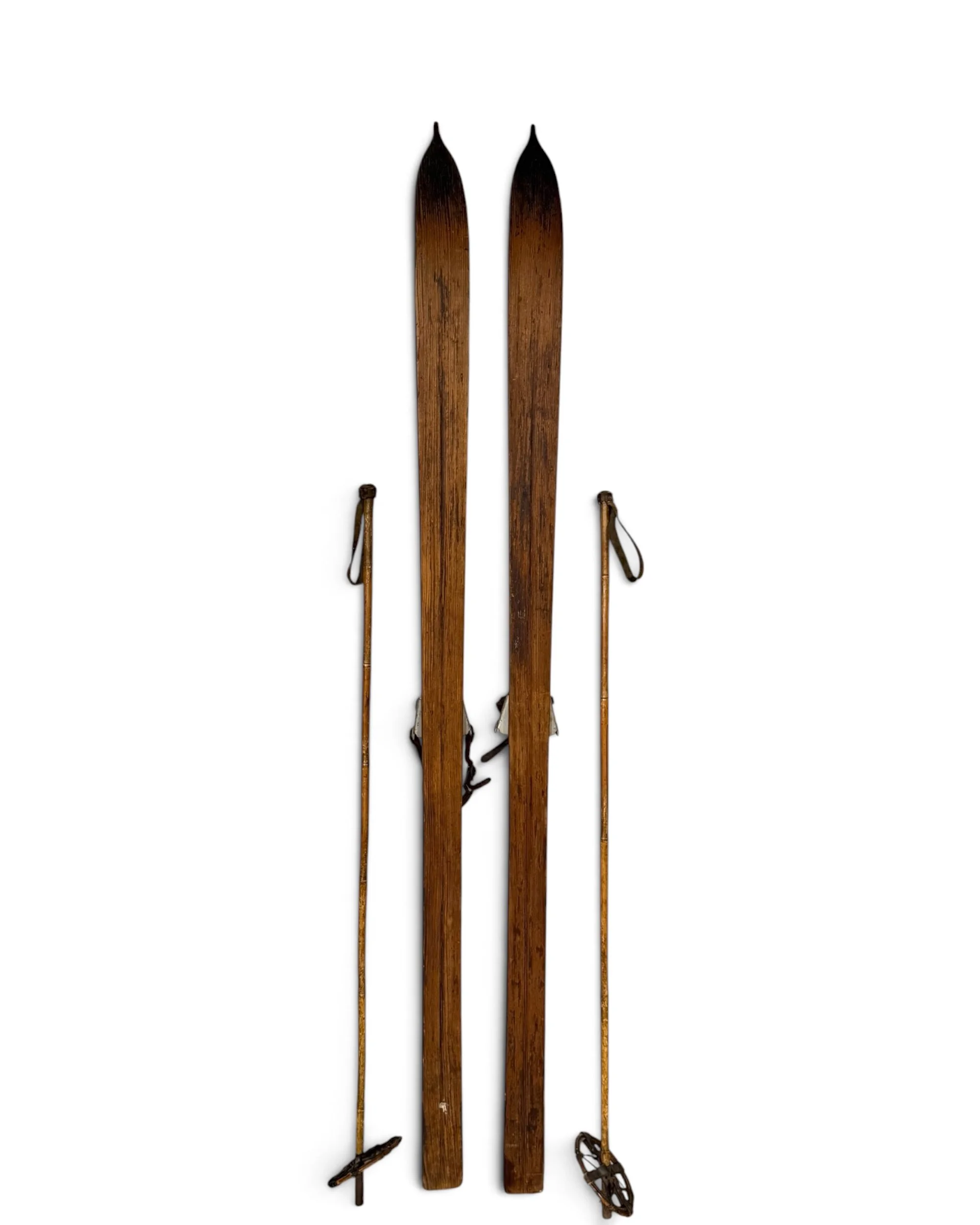 full back view of antique wooden snow ski with poles