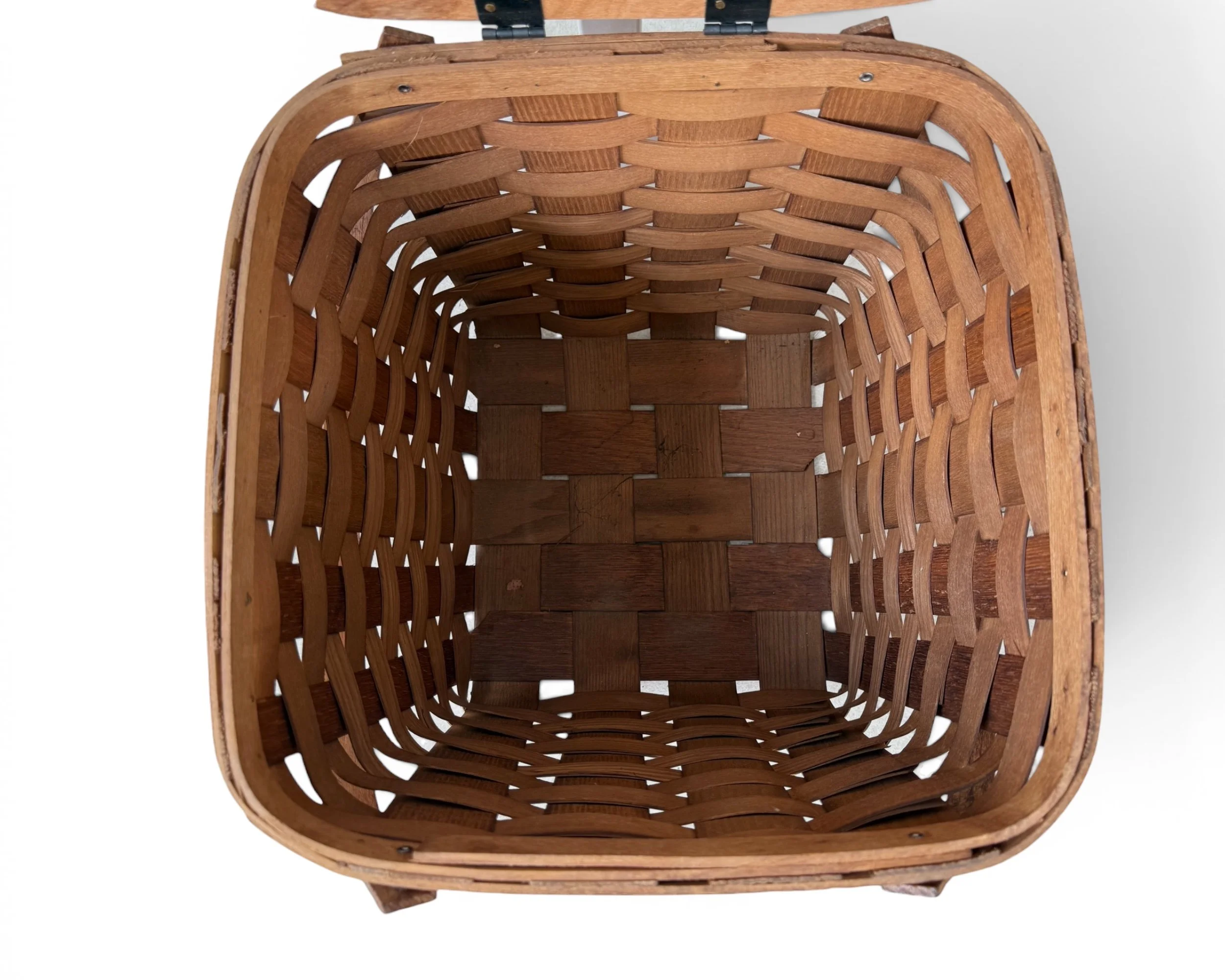 top view of a vintage picnic basket showing a detailed view of the inside