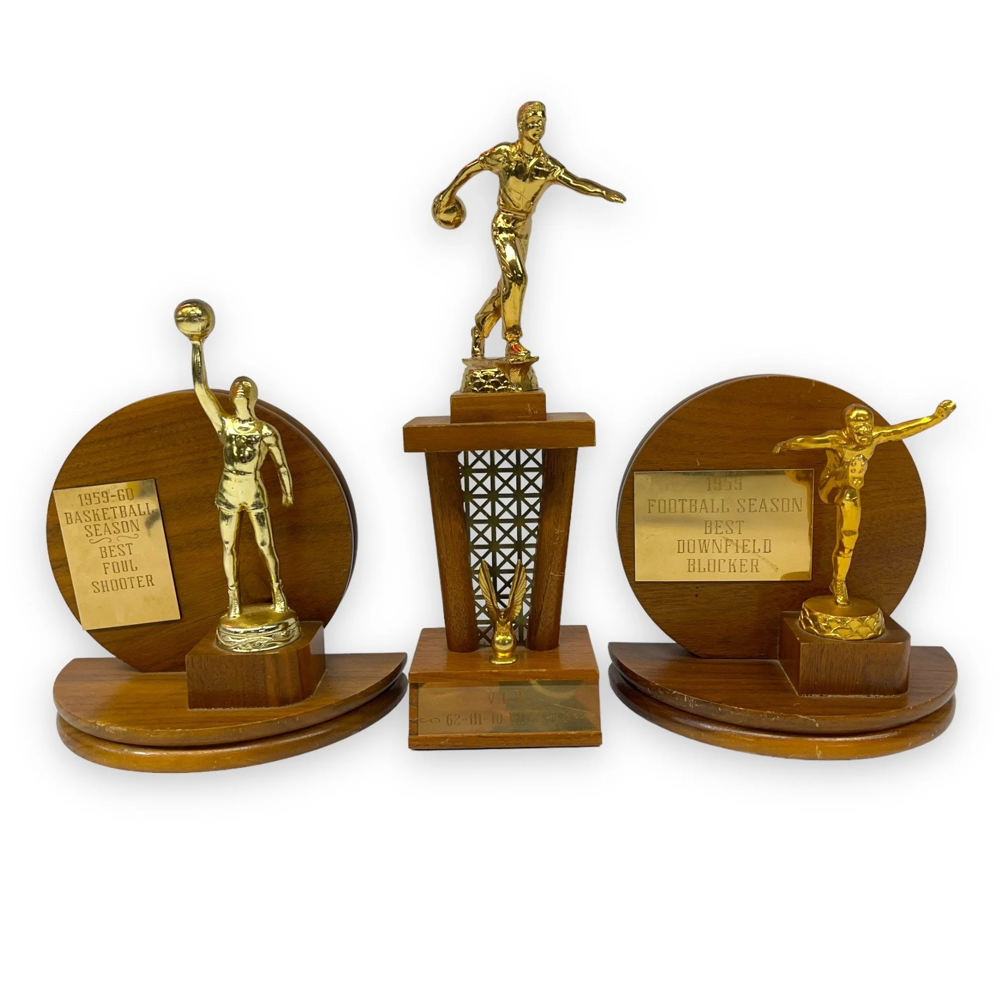 Vintage set of 3 trophies in mid century modern designs. Trophies are from the 50s and 60s and are made of wood with gold metal engraved plates.