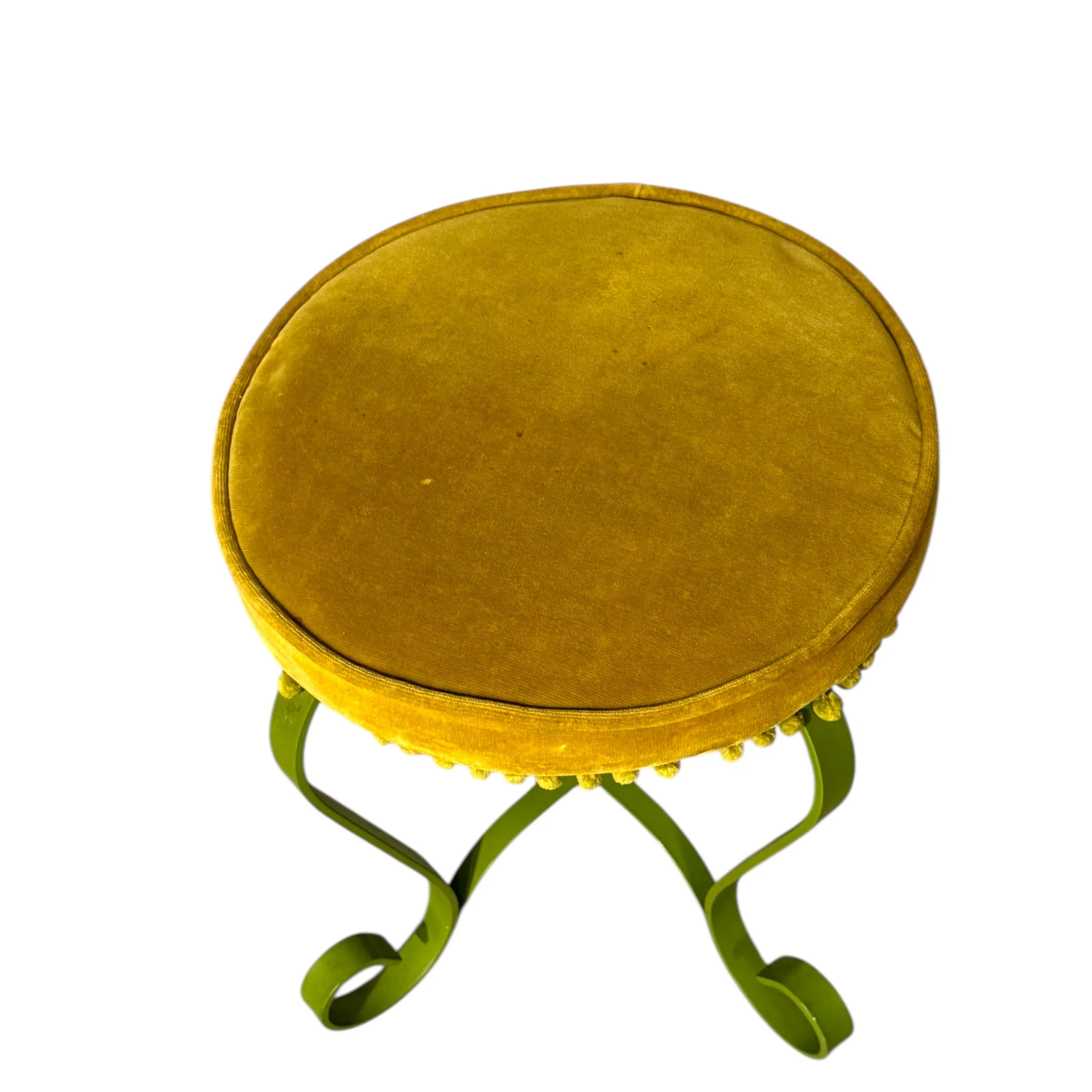 Top view showing round velvet cushion and pom pom