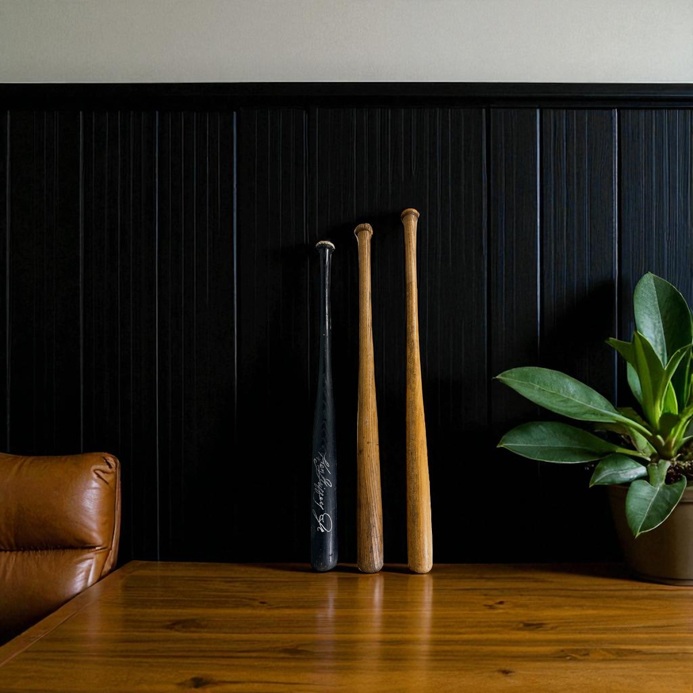 Set 3 vintage wood baseball bats, black and brown.