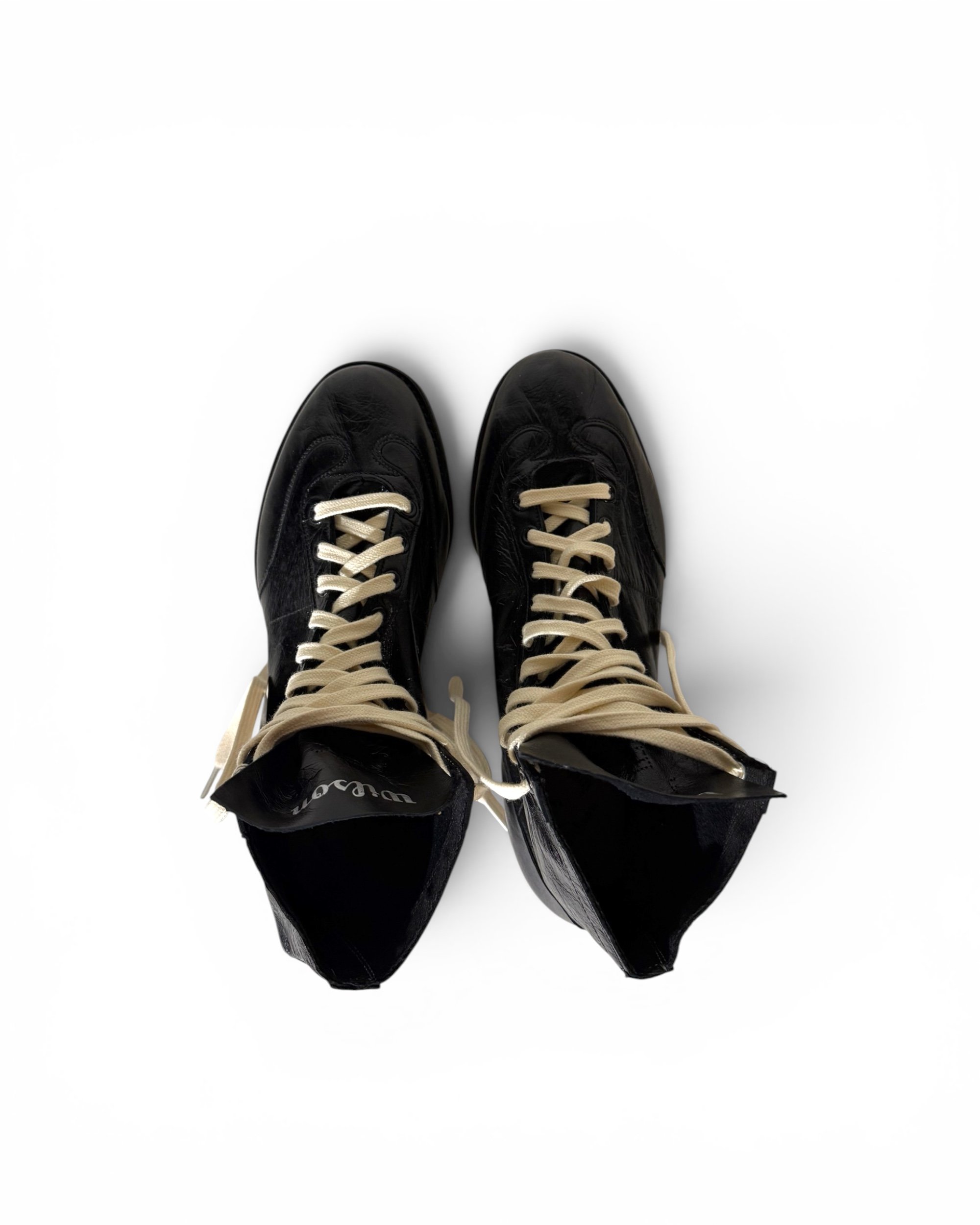 top view of black leather vintage high top football cleats by Wilson