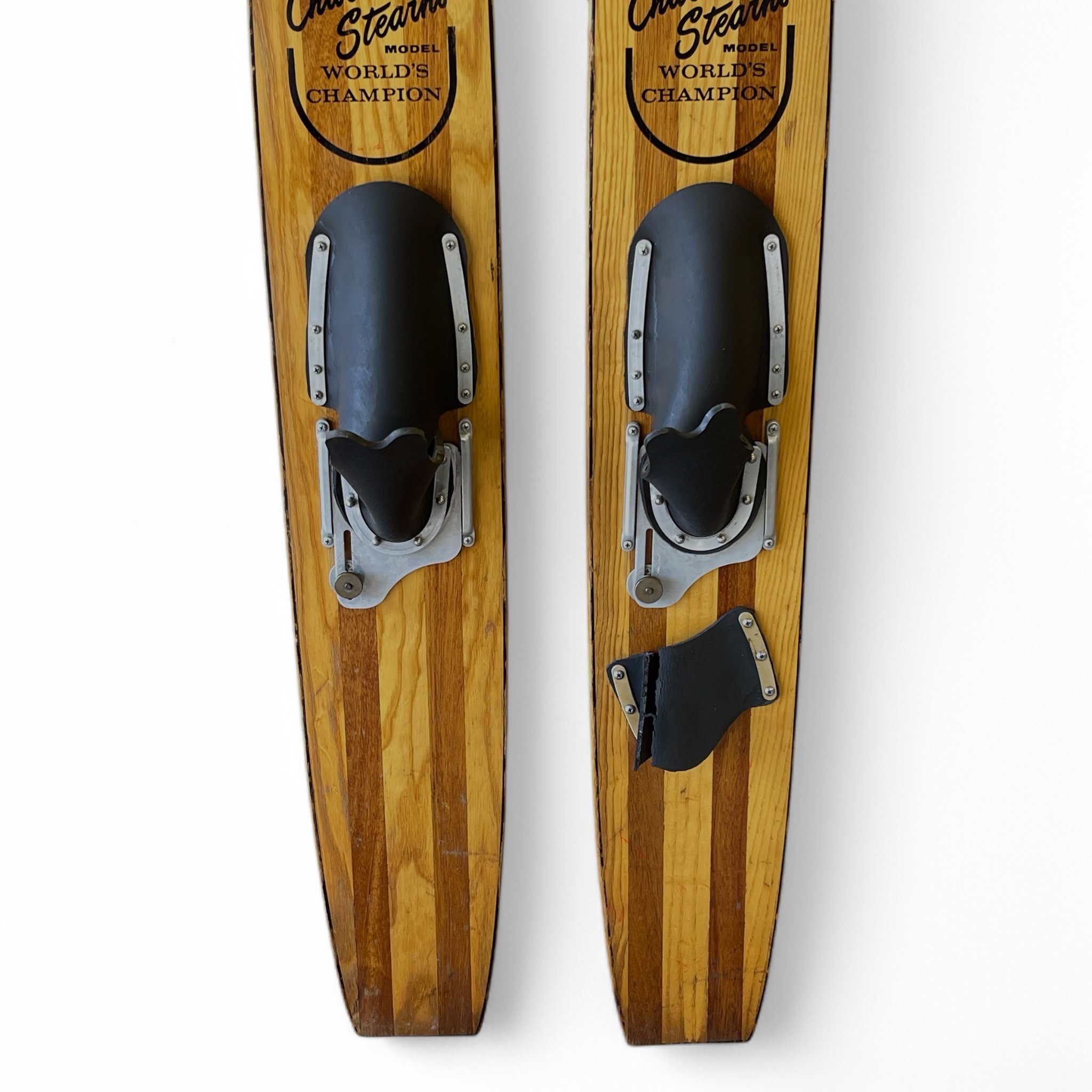 Pair of vintage 1960s Lund wooden water skis, Chuck Stearns Trixter model, perfect lake house decor or for nautical themed rooms.