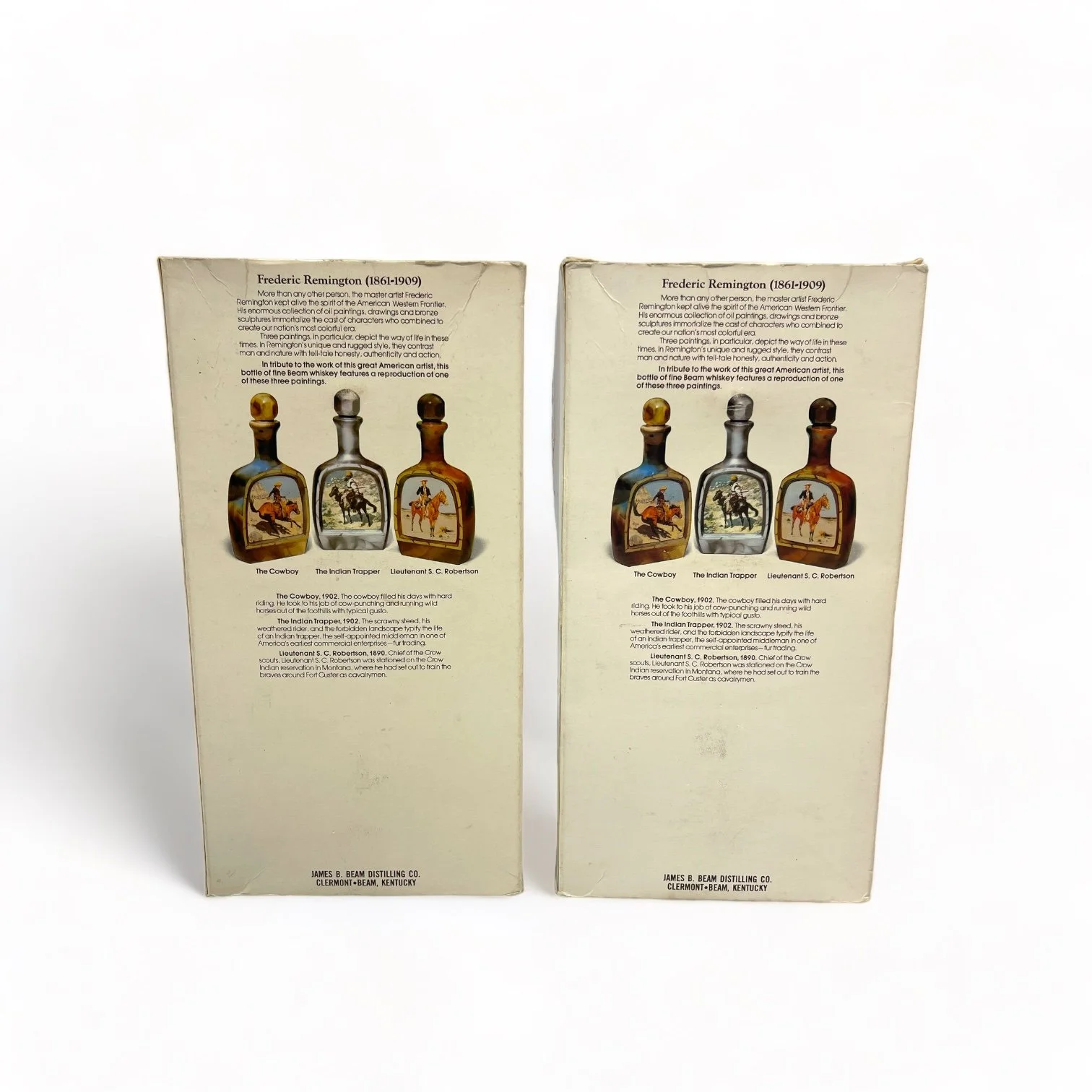 Vintage pair of glass 1970s Jim Beam Choice liquor bottles, featuring the cowboy and the Indian trapper. Perfect home bar decor.