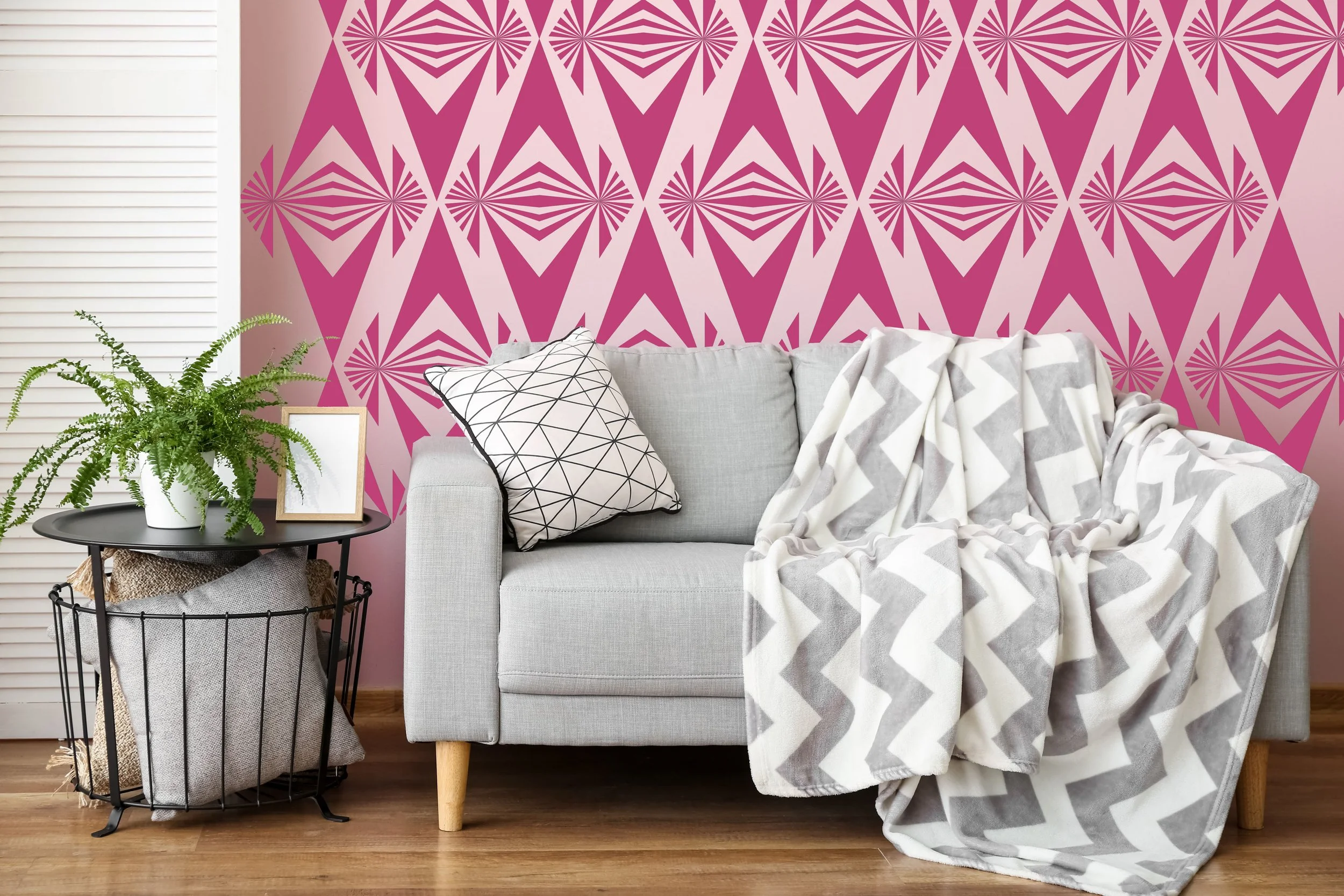 Modern geometric pattern vinyl wall decal by Wall Star Graphics in dark pink on a light pink wall in a mid century living room.