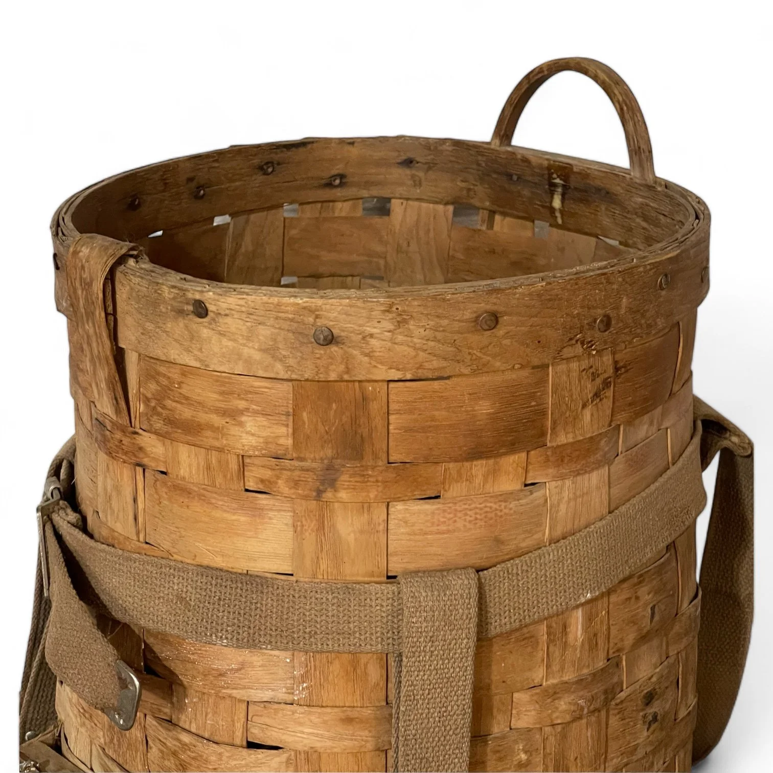 Close up view of a large vintage Adirondack Pack Basket - 2 Compartments, 1 with lid, canvas adjustable shoulder straps.