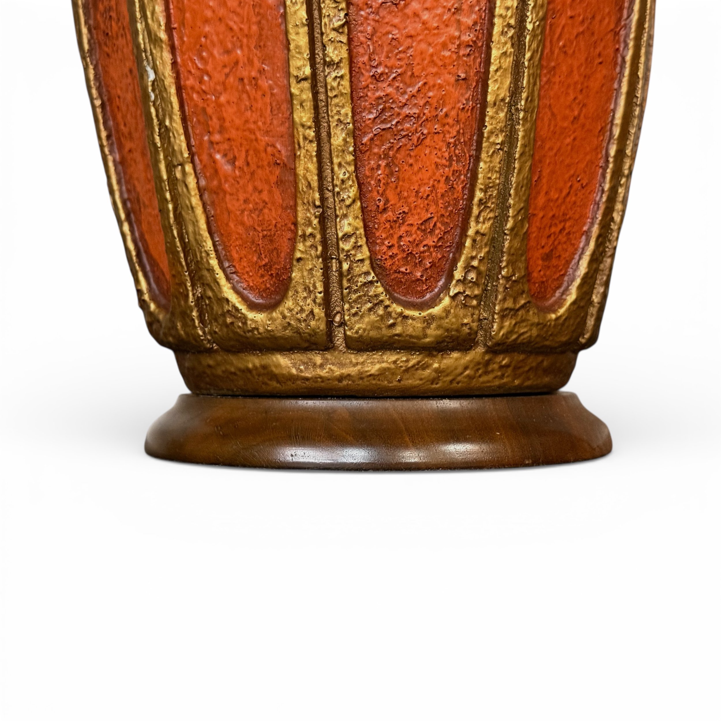 close up view of teak wood base and orange/gold chalkware body detailing rough texture on vintage 60s Emil Bertolozzi table lamp