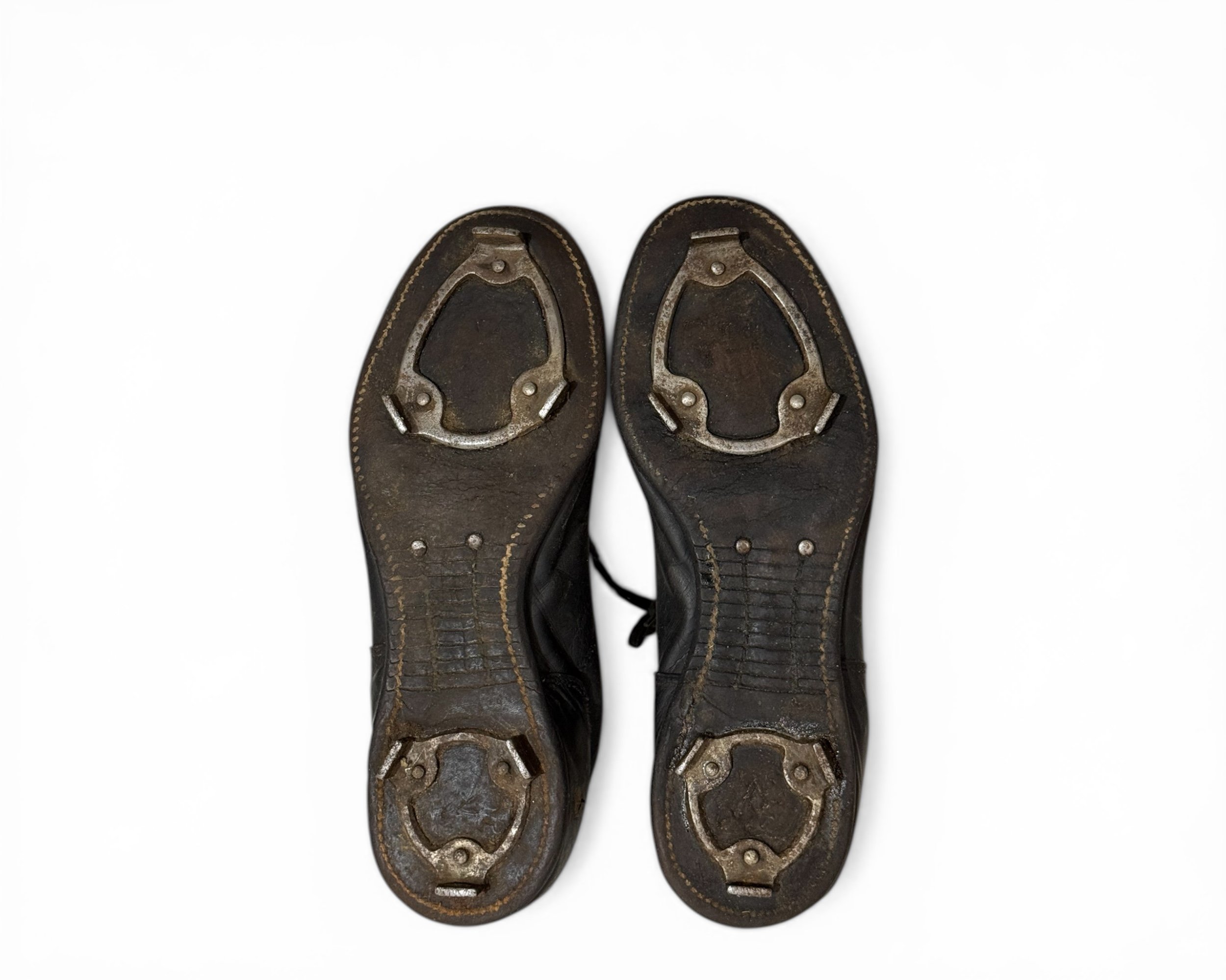 Antique football cleats black leather 1930s gridiron history sports bottom view