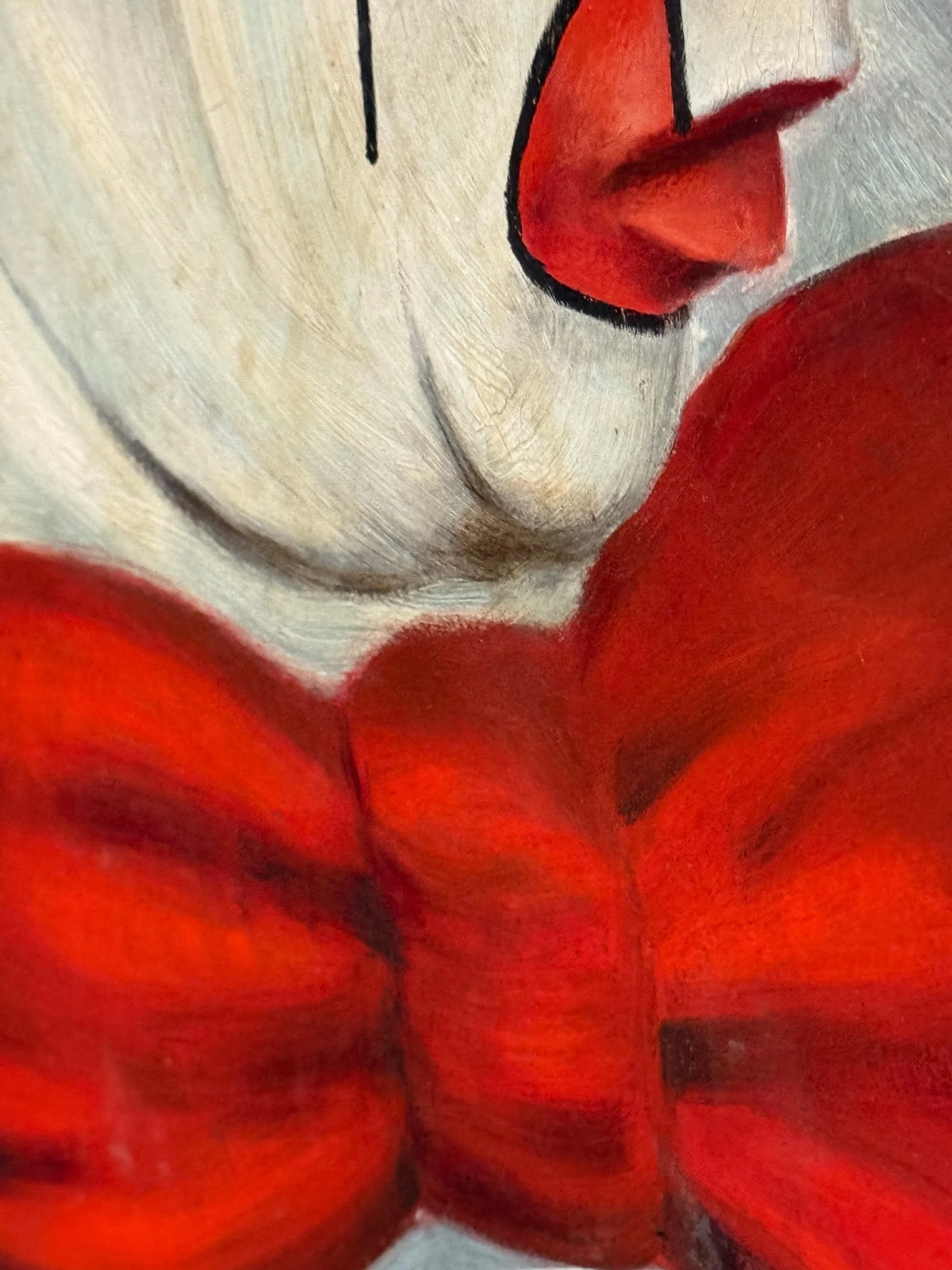 Close up view of brushstrokes on an original vintage 1960s clown painting.