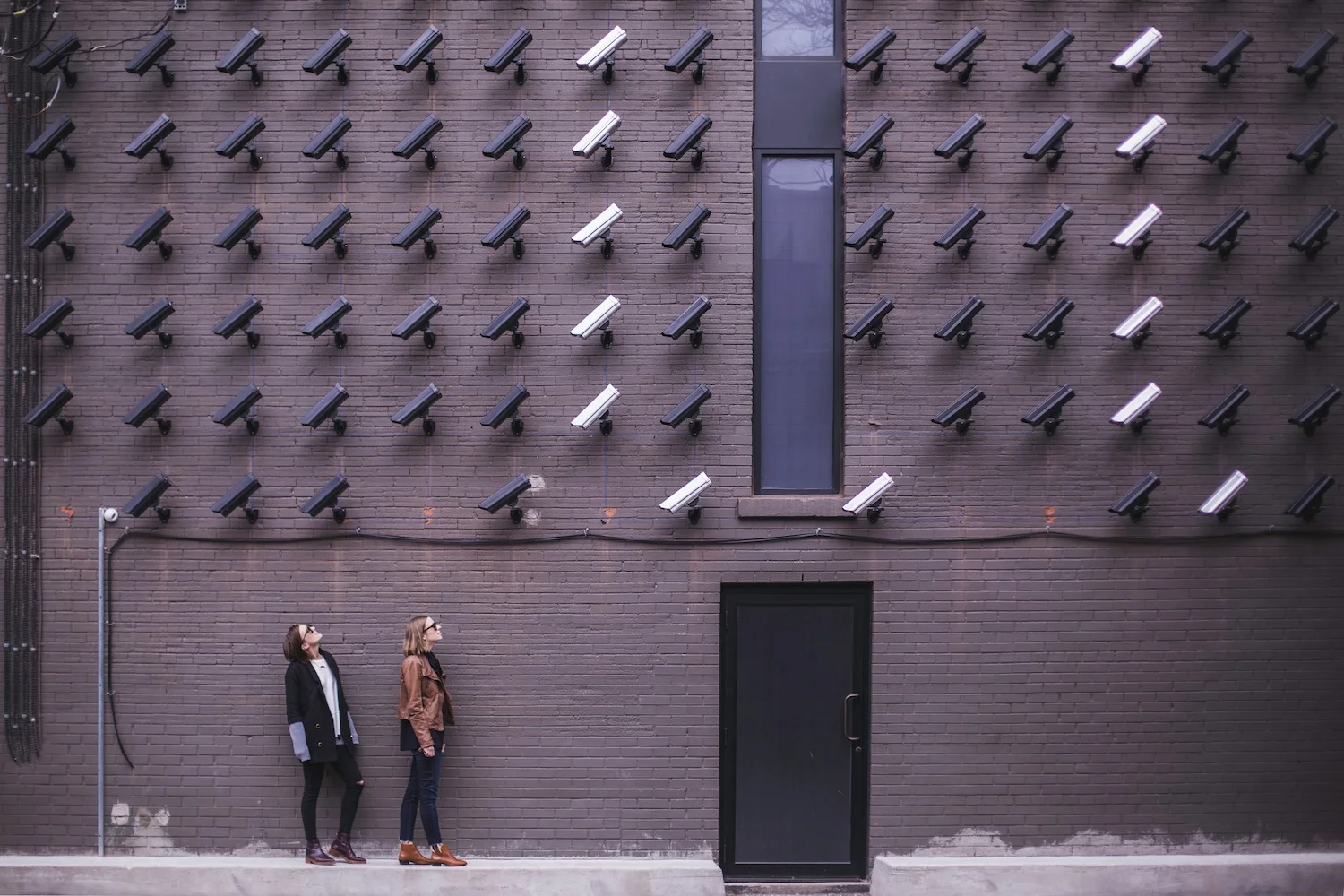 Image Of Security Cameras Looking At People.jpg