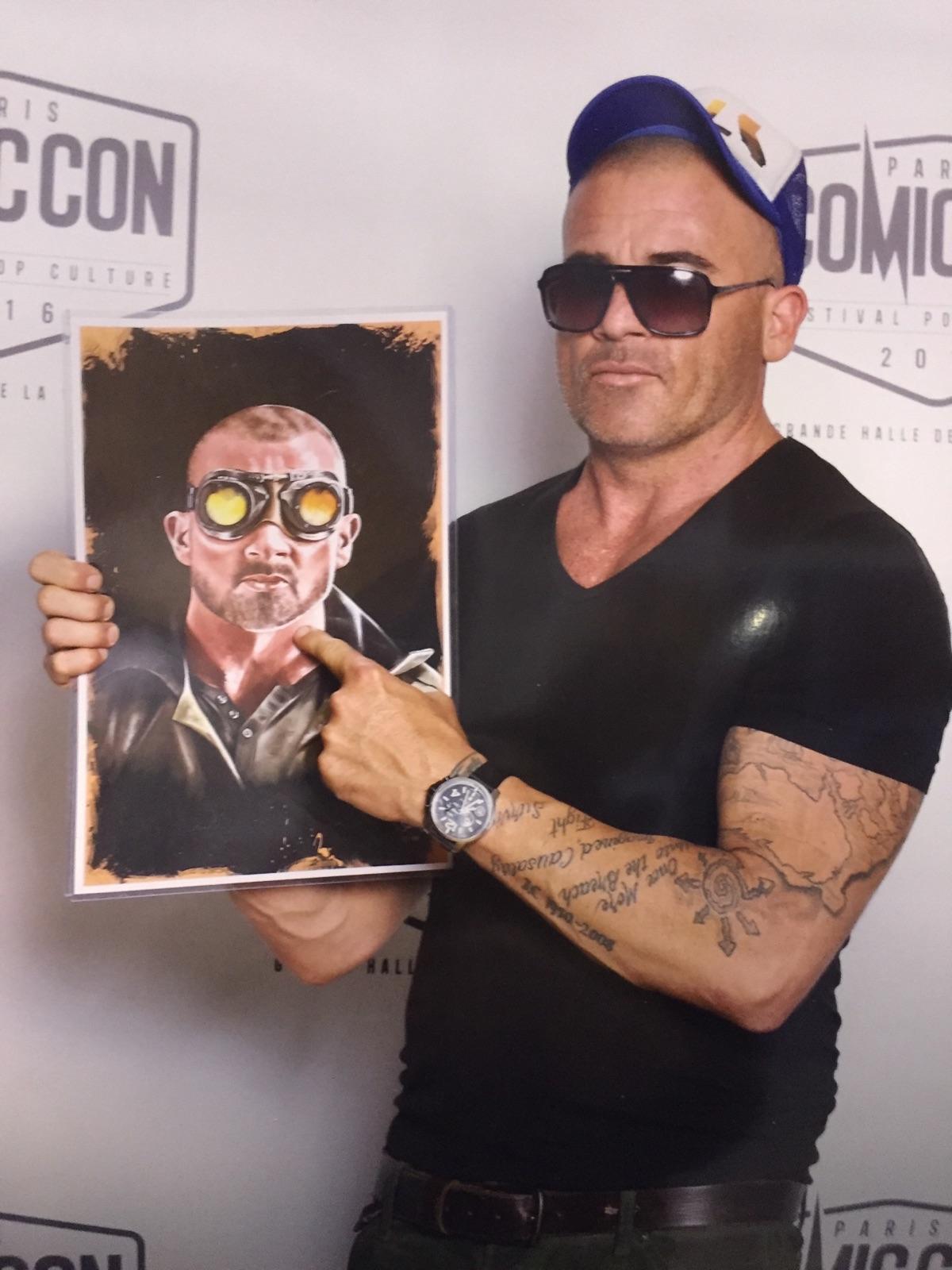 dominic purcell plays heat wave on flash at paris comic con holding my heat wave poster fan art by tony santiago