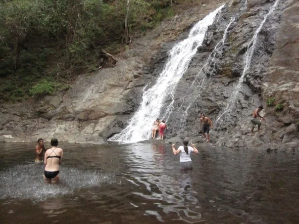Taking a break to appreciate the local waterfall