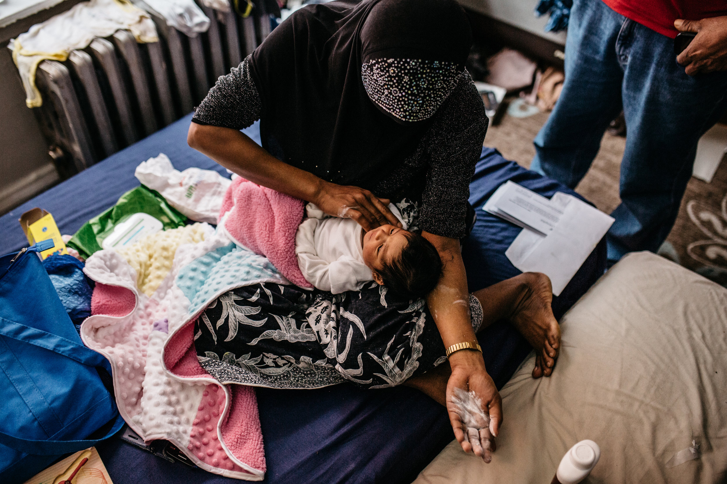  Laila Nobihousen, 20, tending to her 5-day-old baby. In 1982, Myanmar’s military junta revoked the citizenship of most Rohingya, rendering them stateless. So Laila’s child, born an American, is the first person in her family to have any citizenship.