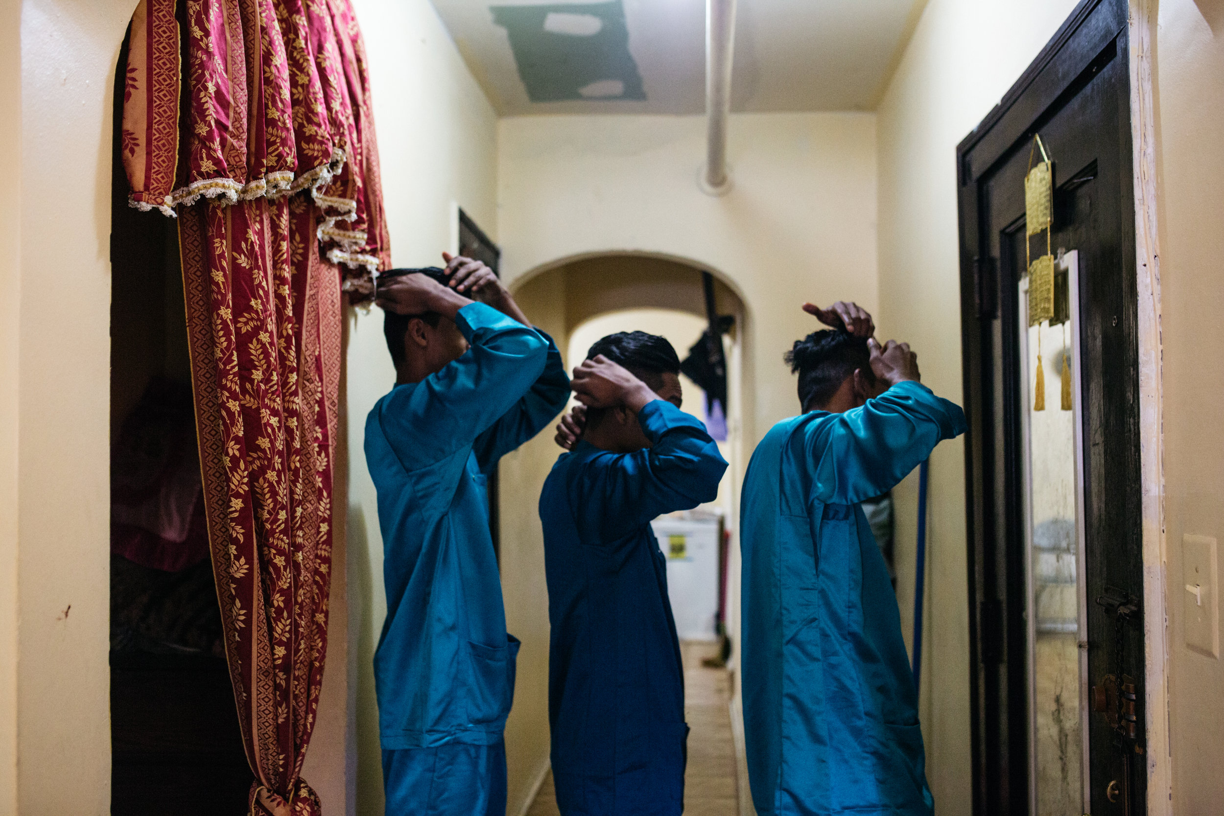  Young men preparing for Eid al-Adha celebrations.     Image 