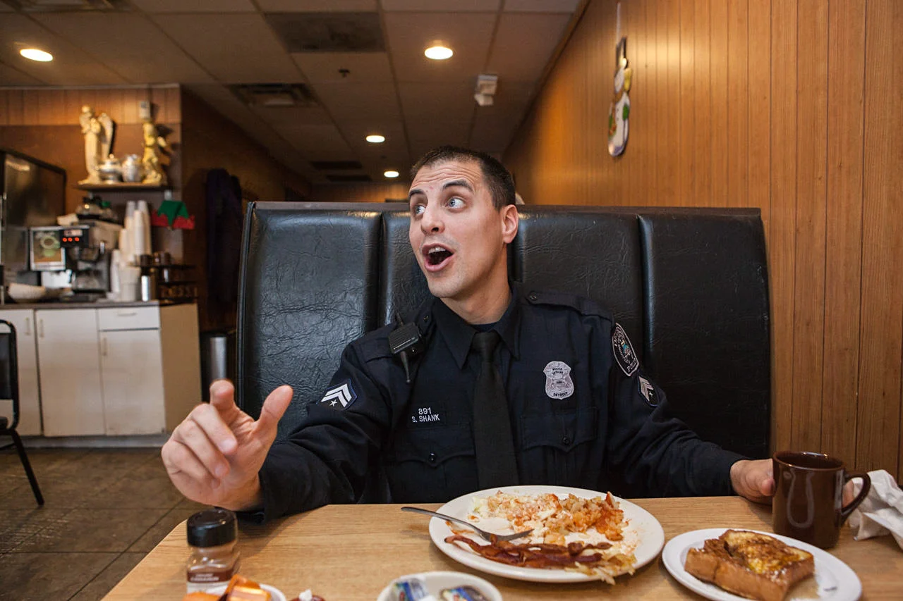 Police officer Steve Shank, a Detroit native, stops at Ham Shop Cafe, one of his favorite places in Greektown.